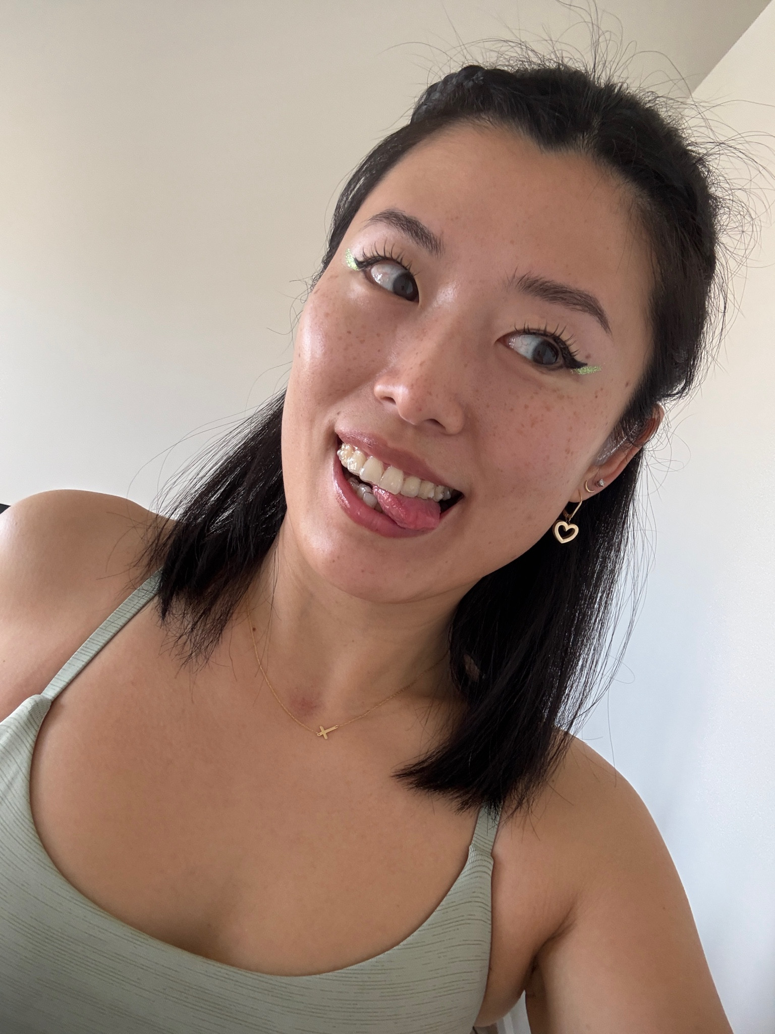 Half magic glitter pill in green, glitter eyeliner, clean make up

#LTKBeauty #LTKActive #LTKSpringSale