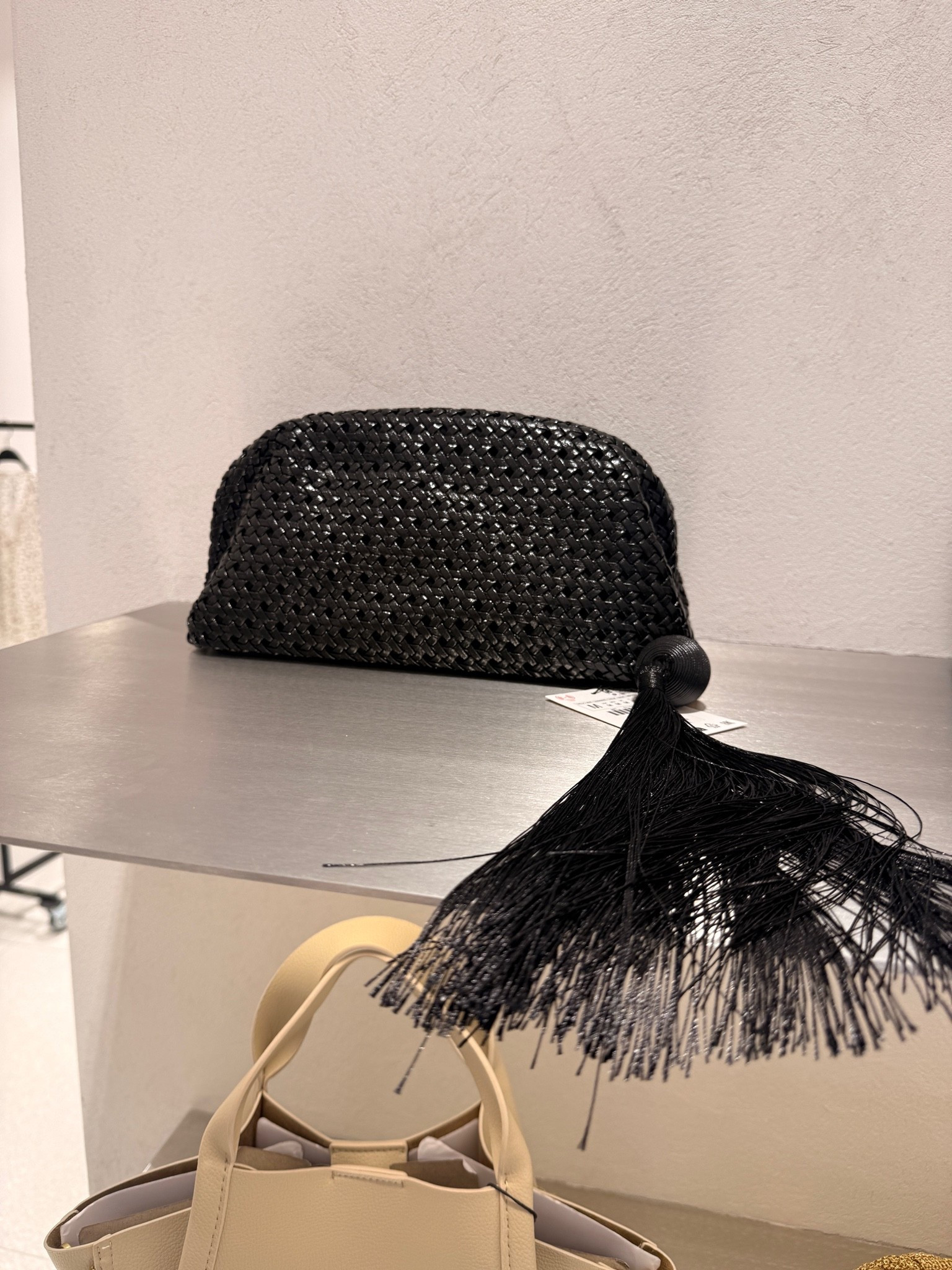 Black woven pouch bag with hanging tassel detail! Staple purse for fall collection!

#LTKootd