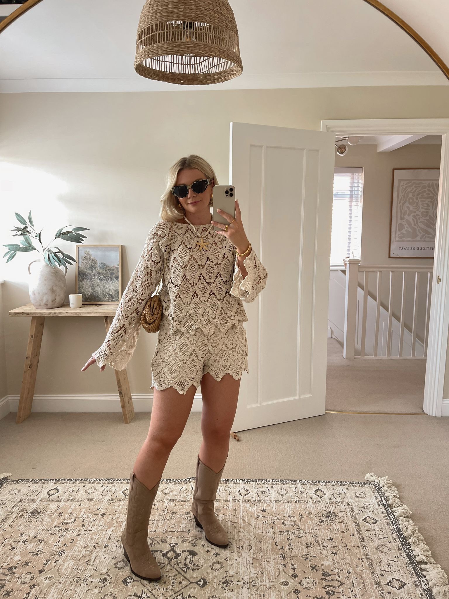 Chic summer festival & Ibiza outfit ideas - cream lace top & shorts Co-ord set from asos, beige suede cowboy boots, mango raffia clutch bag, starfish necklace, & other stories tortoiseshell cat eye sunglassess

#LTKuk #LTKstyletip #LTKsummer