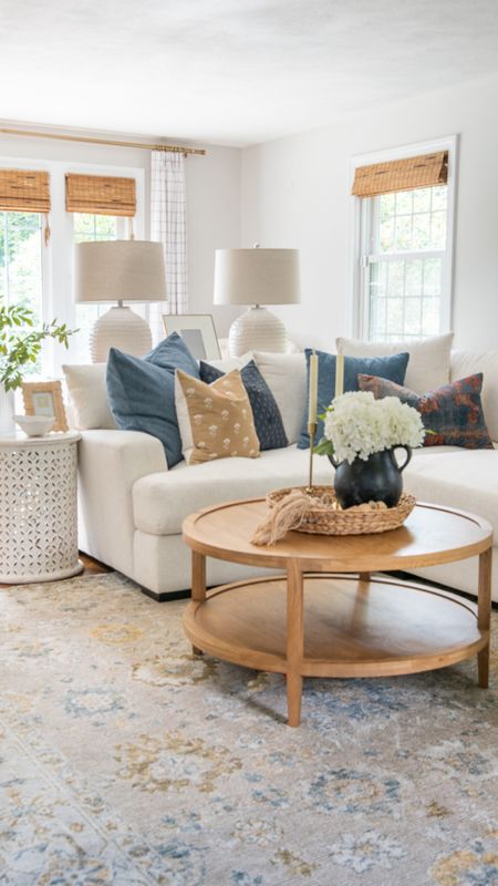 Coastal style living room, home decor, including sofa, round coffee table, area rug, lamps, side tables, artificial flowers, and ceramic vaces and more home decor items

#LTKfamily #LTKhome