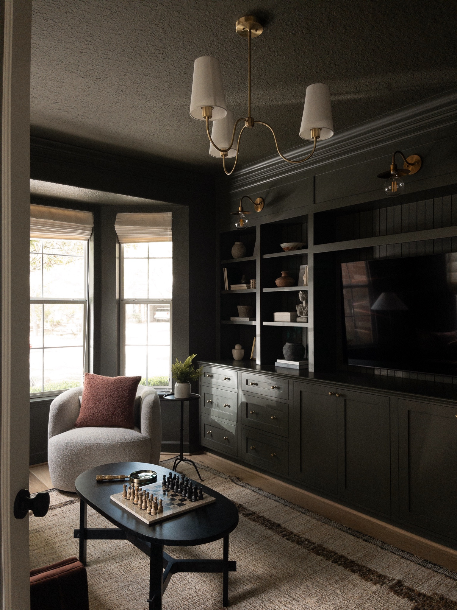 The green room at our Woodlands project!! So excited to share spaces of this finished home! Stay tuned for more!!! 

PS this was Zach’s favorite room in the house! And definitely one of my favorites too!! 

Media room, moody interiors, office, home inspo, rug, chandelier, chairs, coffee table, Builtins, custom built in cabinets 

#LTKhome #LTKsalealert