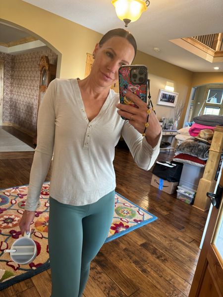 Perfect outfit for running errands and a mom on the go! These shirts are buttery soft and paired with leggings are the perfect stylish comfy outfit. Wearing size small in shirt and size 4 in leggings. 

#LTKOver40 #LTKSeasonal #LTKTravel
