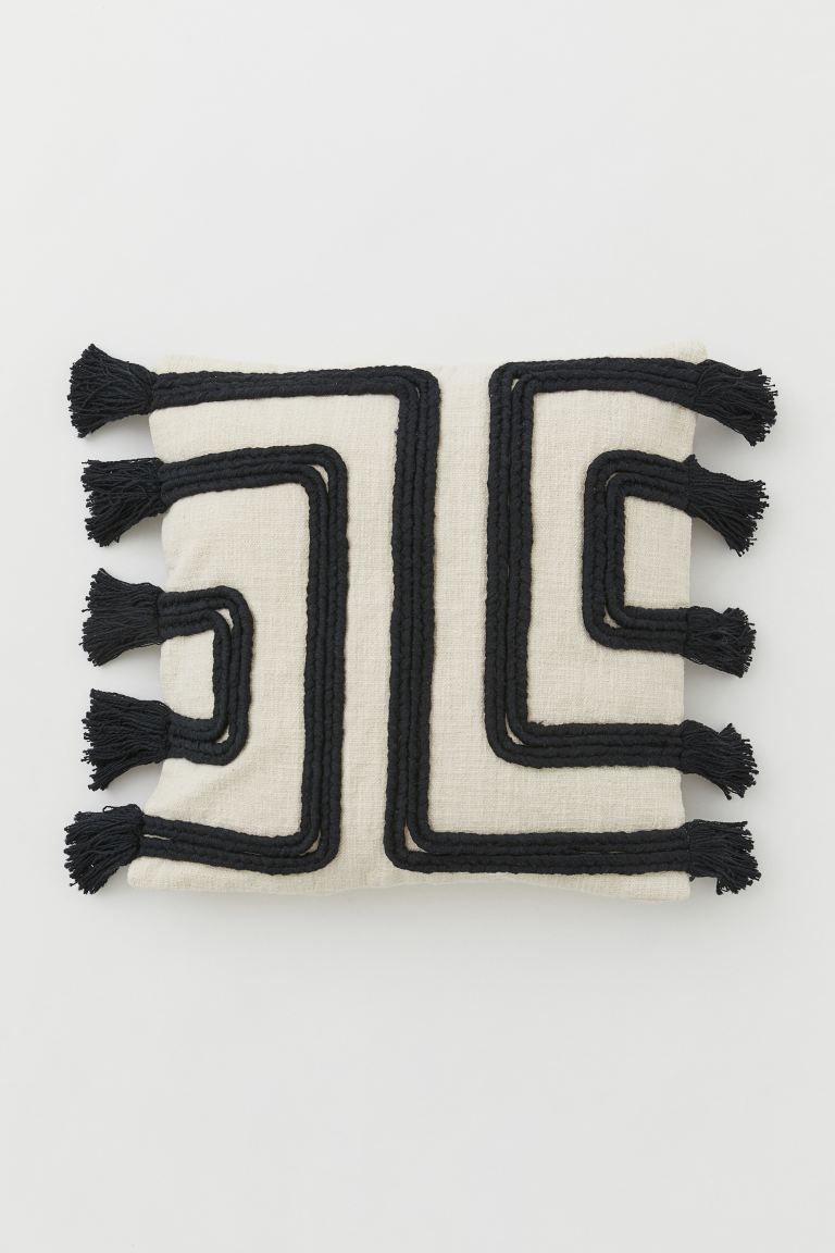 Cushion cover in slub-weave fabric made from recycled cotton. Front section patterned with braide... | H&M (US + CA)