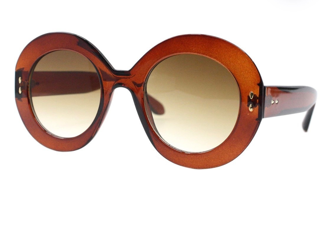 Retro Round Tortoise – Old Hollywood Energy

Think oversized round frames with a rich tortoise shell finish and 

warm brown lenses. These give instant “movie star at brunch” and are perfect with a messy bun, red lip, and trench coat. They mimic the look of iconic designer rounds but at a price you won’t baby on vacation.

Style tip: Pair with neutral outfits and a structured bag so the dramatic shape stays the focal point.

#LTKSaleAlert #LTKBeauty #LTKootd