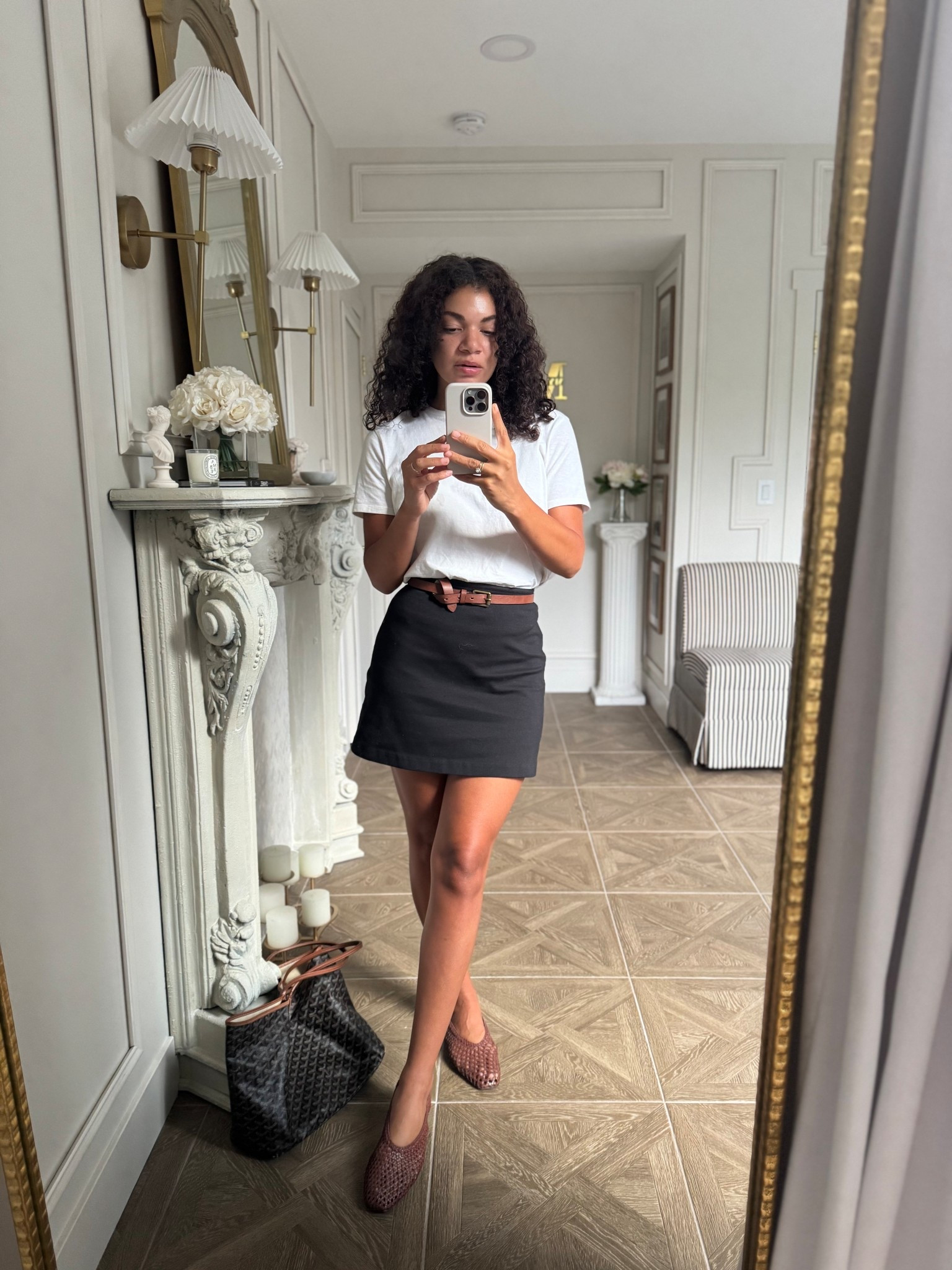 Warm early fall outfit: white tee, black mini skirt, brown belt, brown woven flats 

#LTKSeasonal #LTKFindsUnder100 #LTKStyleTip