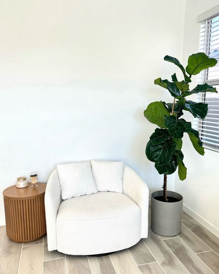 Cozy corner in my living room with this adorable ivory swivel boucle accent chair, natural wood side table and grey faux cement planter for that natural organic clean aesthetic. 


#LTKfindsunder50 #LTKMostLoved #LTKhome
