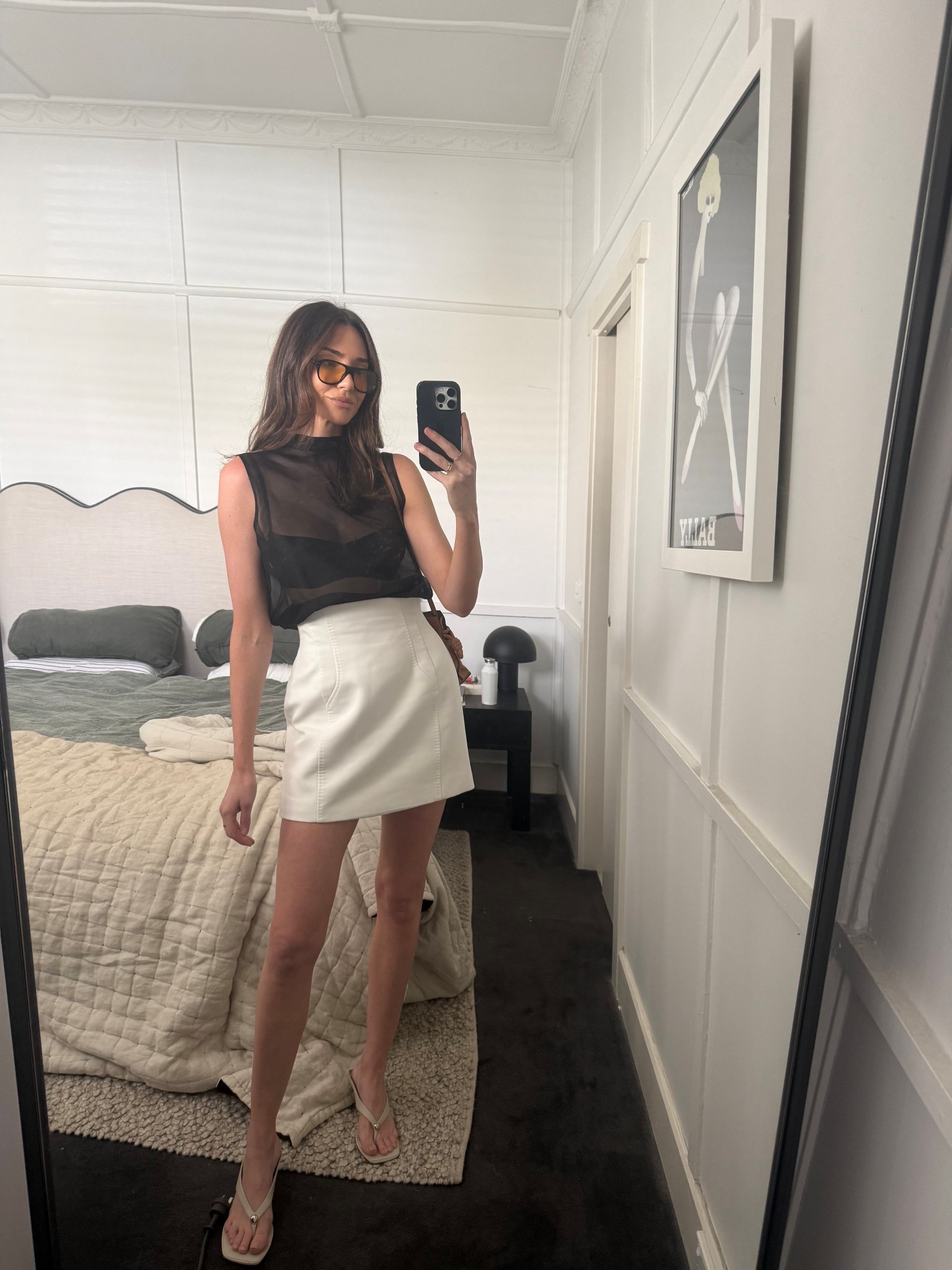 OOTD 

Black sheer top 
White mini skirt 
Sunglasses 
Tan leather bag 

#LTKstyletip #LTKsummer #LTKaustralia