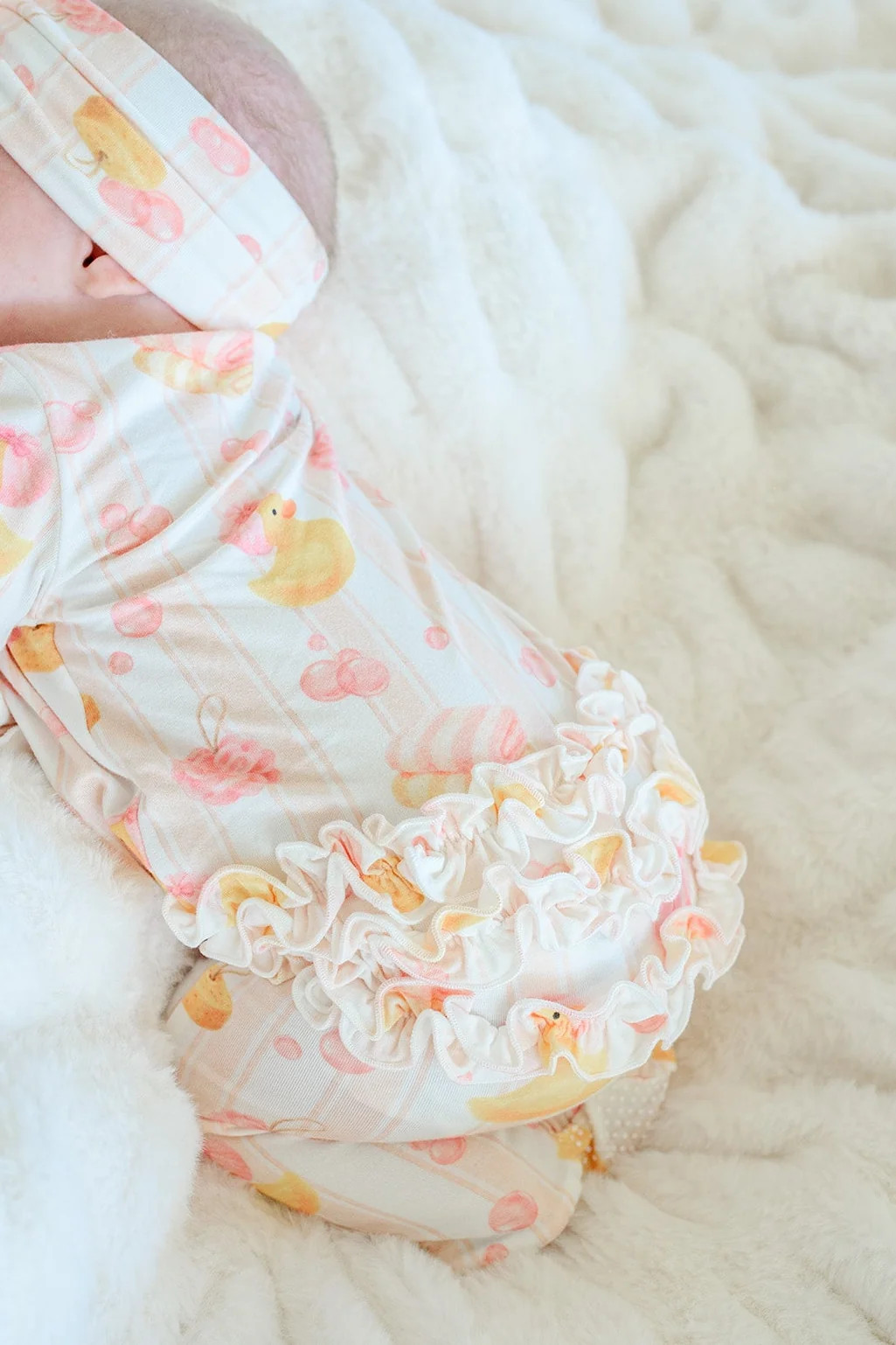 Ruffle Bamboo Zipper Footie | Bubble Duckies Pink | Caden Lane