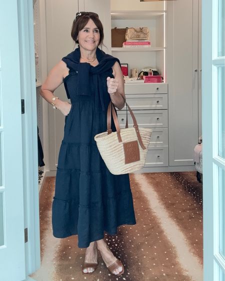 This @onequince navy linen dress is so cute and comfortable! Pair it with caramel accessories and drape a cashmere sweater over your shoulders for the perfect coastal chic look for summer! I am wearing my usual size XS in the dress and took a small sweater.   #quincepartner 

Europe dress, travel outfit, summer Europe style 

#LTKSeasonal #LTKFindsUnder100 #LTKStyleTip