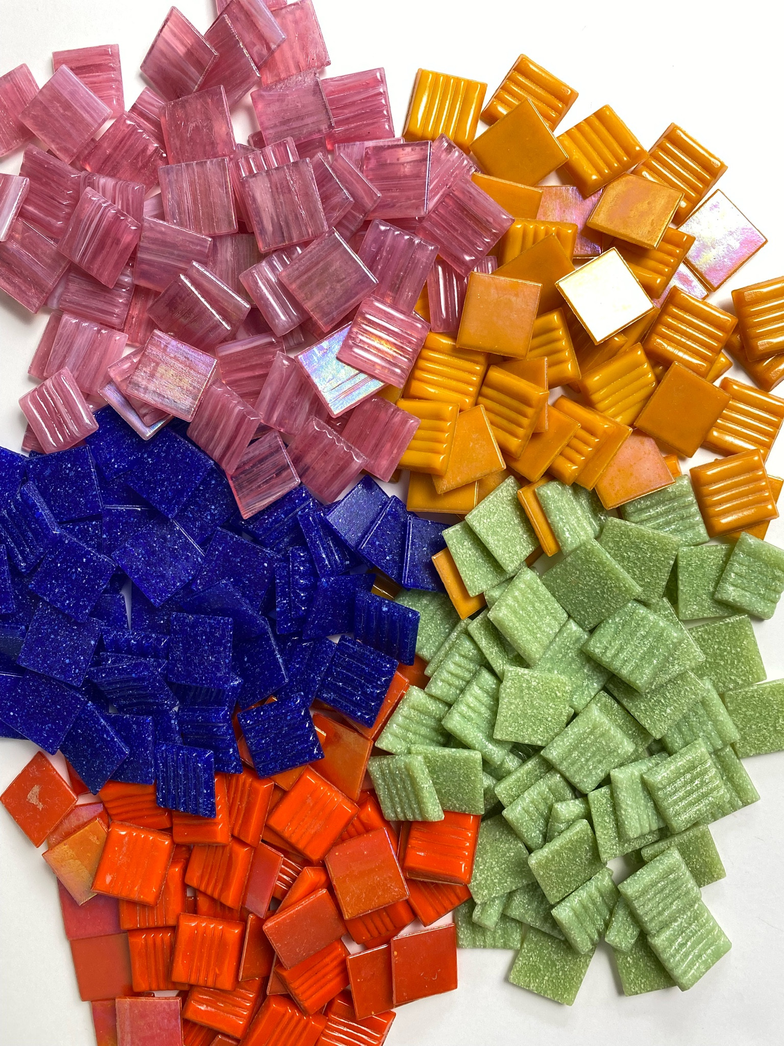 One way to make your next mosaic feel more spring or summer-like is to use vitreous glass tile in seasonal colors. 

They’re easy to break with wheeled glass nippers and super versatile. Nip away at them to create fun shapes!

For mosaic tips, tutorials, inspiration, and so much more please visit my YouTube channel: YouTube.com/julieweilbacher. 

Follow @julieweilbacher on Instagram for all things mosaic including mixed media mosaic, mixed media art, stained glass art, stained glass mosaic, murrini, millefiori, arts and crafts, studio organization, crafts organization, arts and crafts organization, art space, art studio, mosaic studio, mosaic workshop, art workshop, stained glass storage, mosaic tesserae, mosaic materials, mosaic tile, mosaic glass tile, glass tile, glass rods, stained glass, vitreous glass, mosaic home decor, mosaic wall art, mosaic mirror, mosaic projects, mosaic candle holder, mosaic votive, mosaic table, mosaic flower pot, mosaic crafts, beginner art, mosaic workshop, beginner mosaic, fine crafts.

#LTKGiftGuide #LTKSeasonal #LTKhome