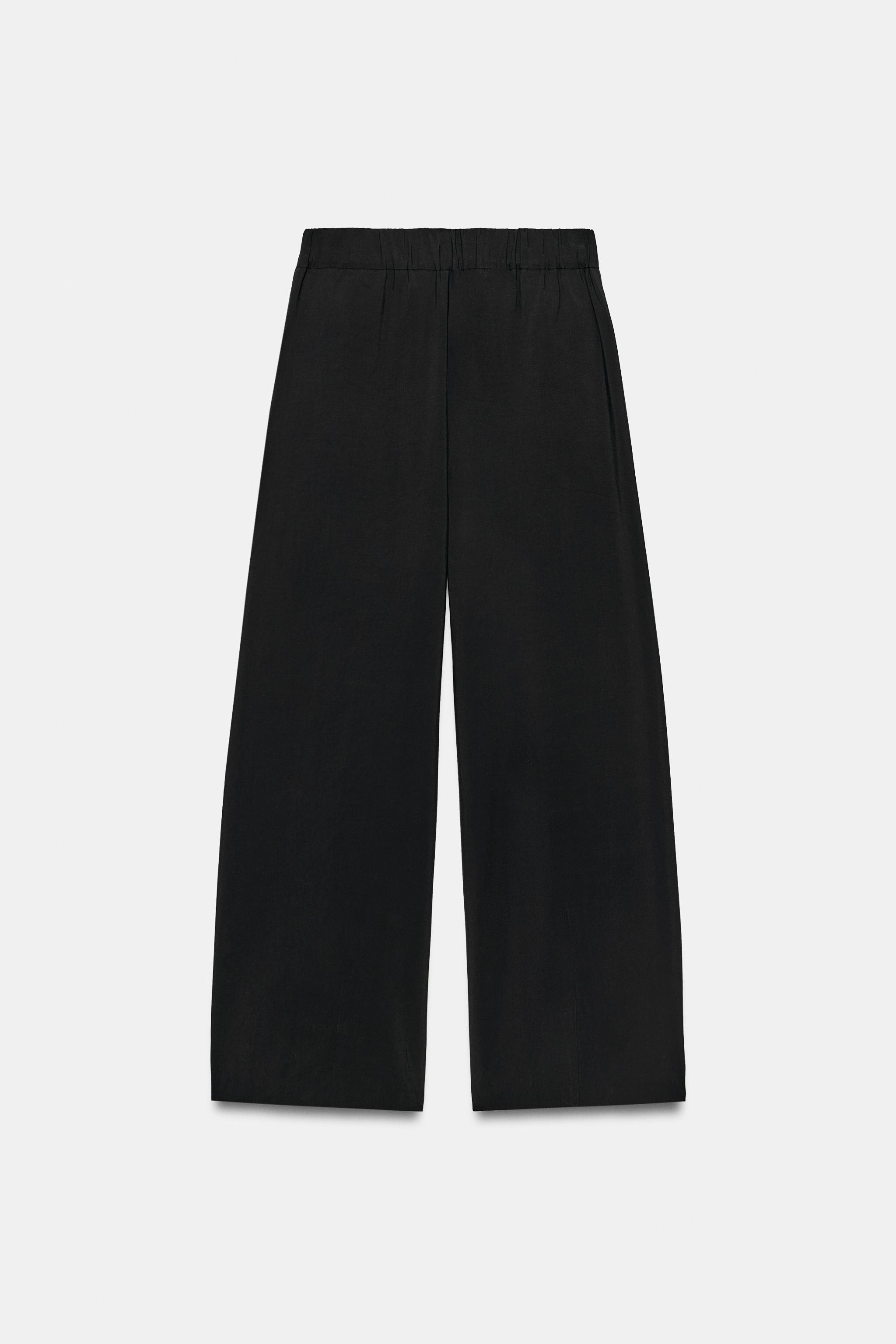 High-waisted pants with front pleats and an elasticized back waistband. Front pockets. Loose leg ... | Zara US
