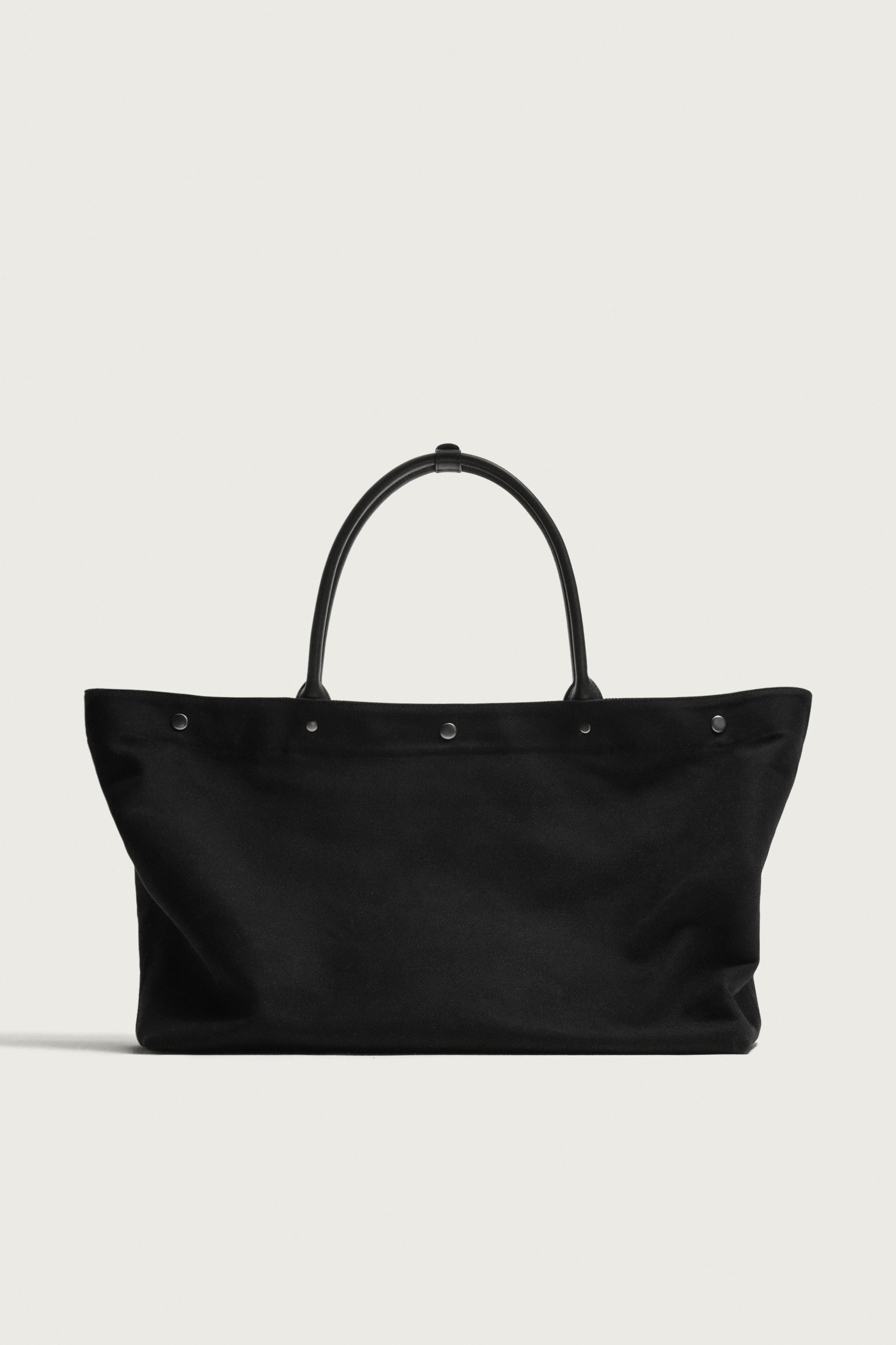 Model height: 188 cmFabric tote bag. Main compartment with press-stud fastening. Two inside pocke... | Zara UK
