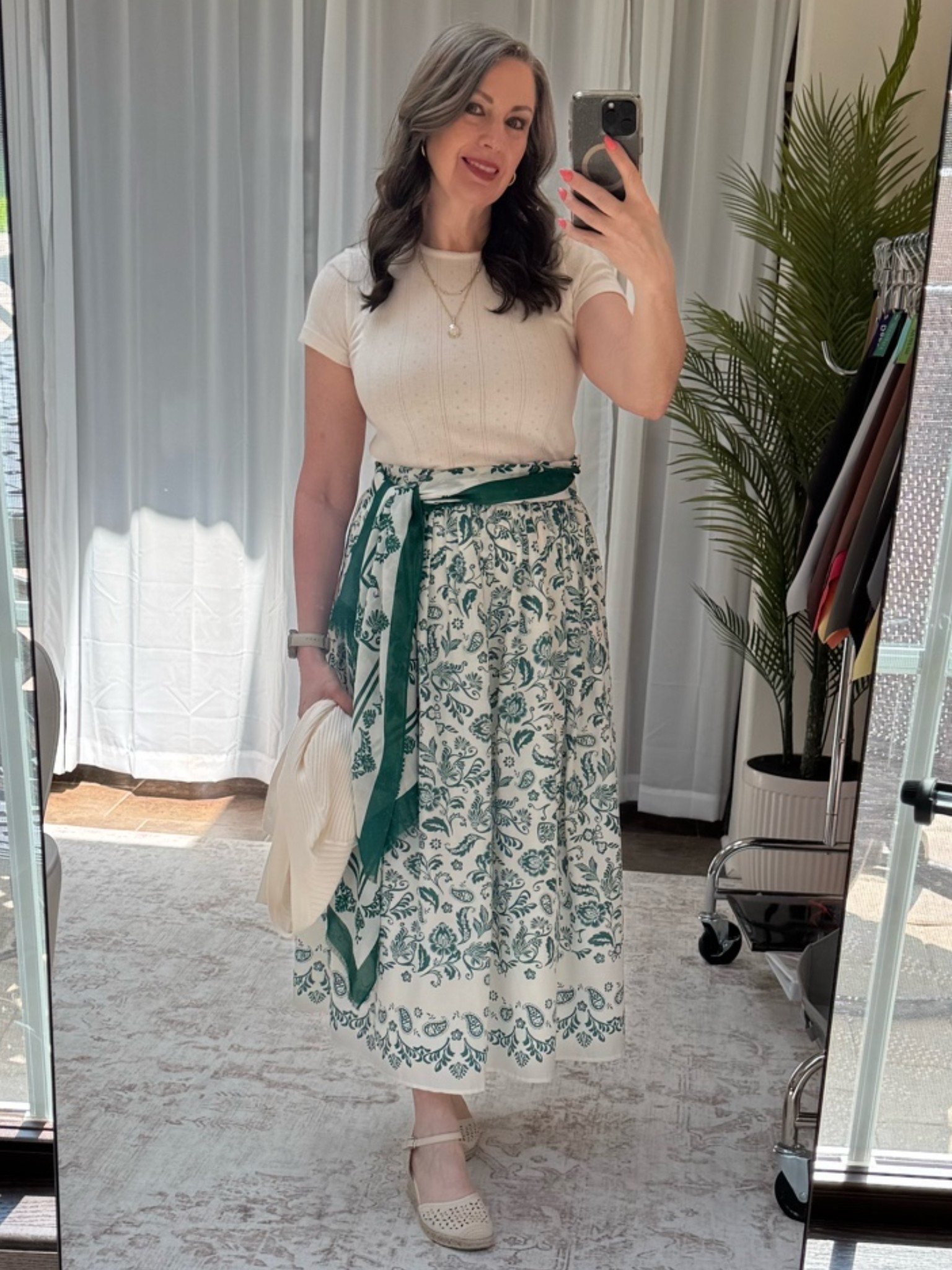 Can we talk about these shoes for a minute? 🤍

I don’t say this often, but these are one of those purchases I’m so glad I made. They’re incredibly comfortable, have the perfect low wedge, and I can wear them for hours without my feet complaining. Finding shoes that are both stylish and comfortable feels like a win!

The rest of this outfit is from LOFT and has quickly become one of my summer favorites. I’m wearing their short-sleeve cotton baby doll tee with beautiful eyelet details, paired with this gorgeous printed wrap skirt. Instead of wearing the coordinating scarf around my neck, I tied it around my waist as a belt—and I love how it adds color, defines my waist, and gives the outfit a polished, styled look. The lightweight sweater I’m holding is perfect to throw on when the air conditioning is a little too chilly.

✨ Color & Confidence Tip: Don’t overlook your scarves! They make beautiful belts, handbag accessories, or even hair ties. Sometimes shopping your own closet is the best styling trick of all.

I’ve linked the shoes, top, skirt, scarf, and sweater if you’d like to recreate the look!

#LTKootd #LTKmomlife #LTKOver40