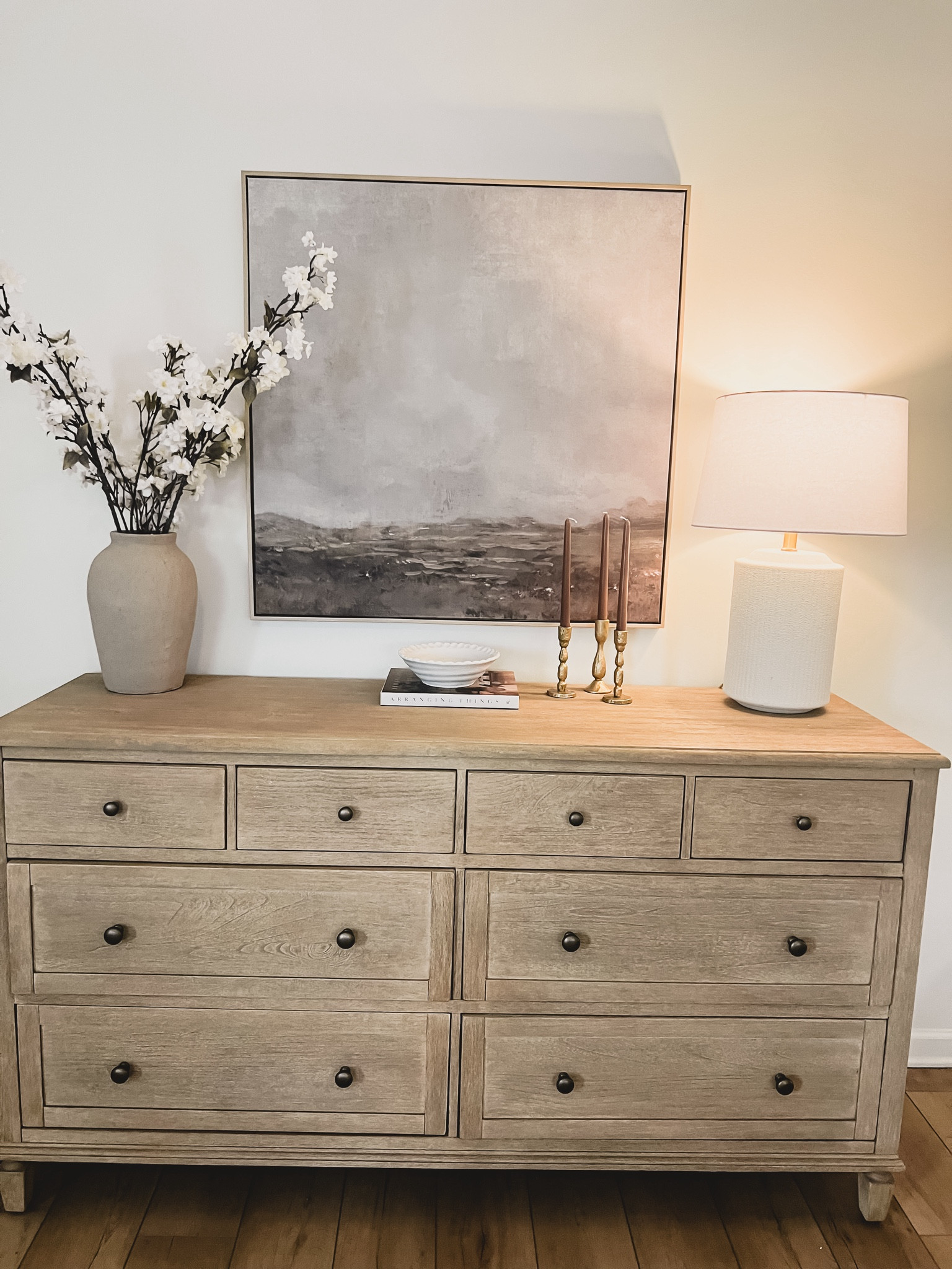 Neutral dresser with neutral framed canvas print. Spring florals. White lamp. Pottery barn dresser 

#LTKxTarget #LTKhome