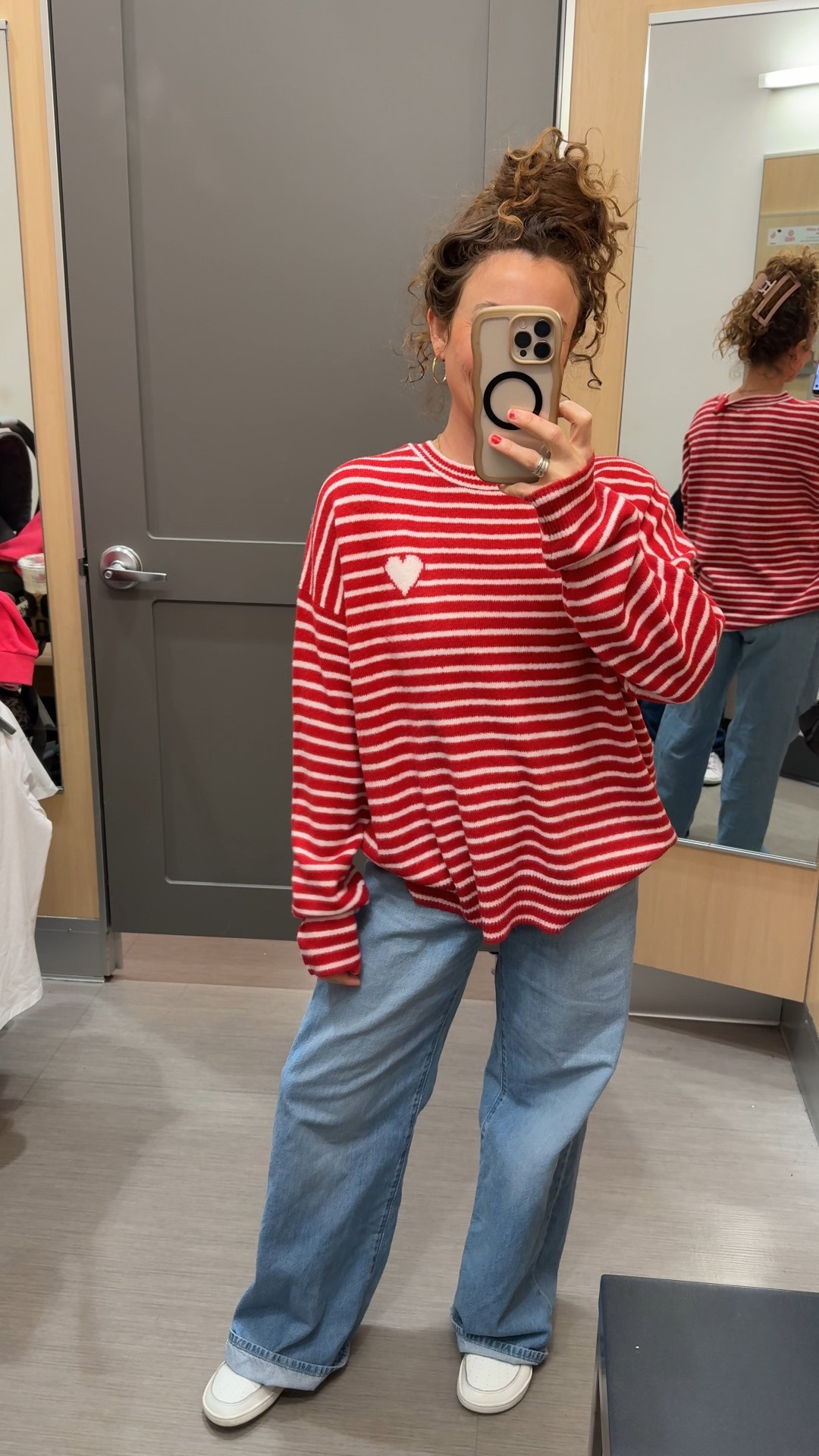 Large in valentines striped sweater 
25 in the Levi’s cinch jeans 