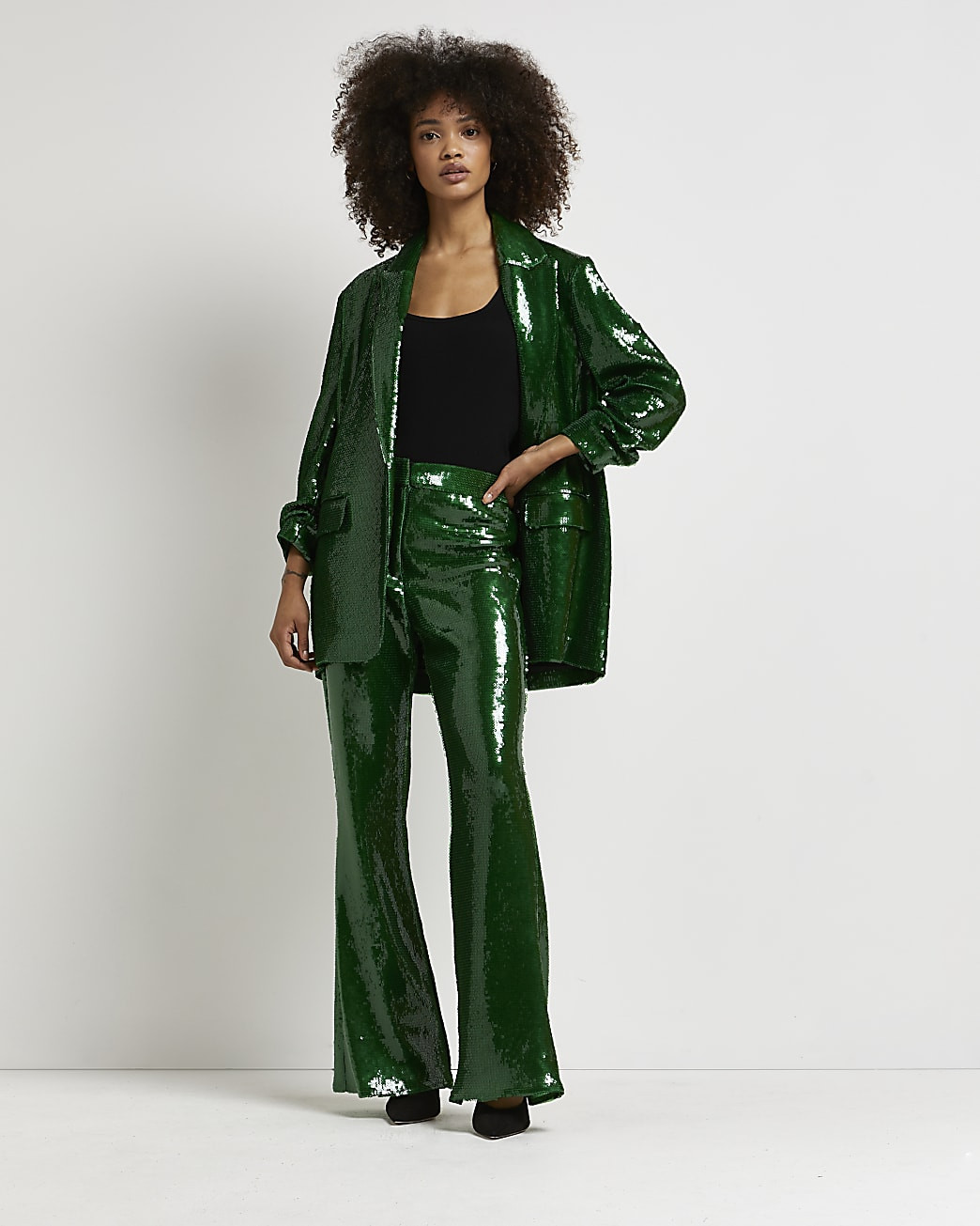 Green sequin flared trousers | River Island (UK & IE)