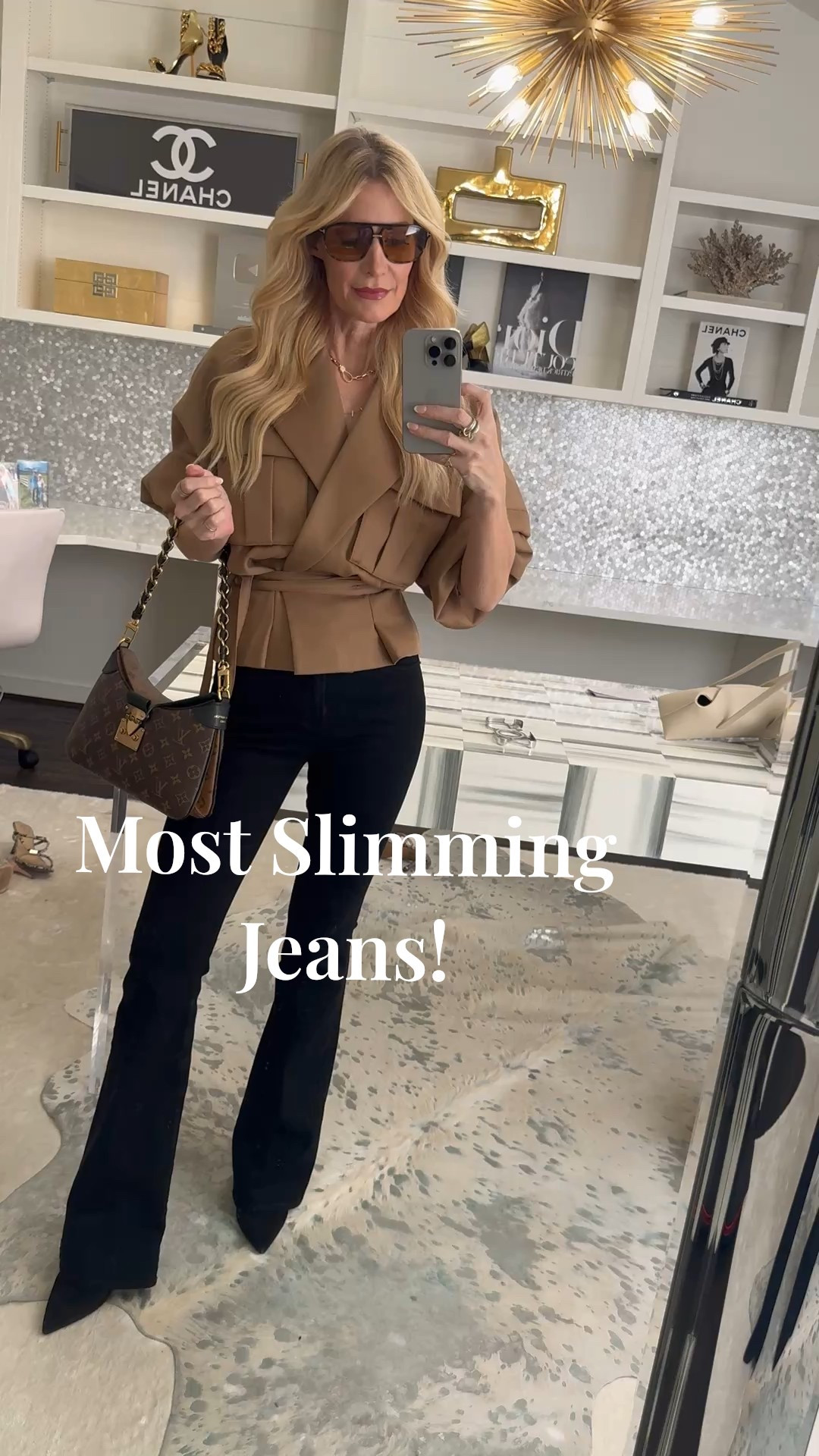 Hands down the most slimming jeans I’ve ever put on 🙌( I know I've said it before, but SERIOUSLY!) These are the Veronica Beard Beverly skinny flare jeans in the prettiest black wash, and they give you that snatched leg line while still feeling super current (yes—skinny flare is going to be a major 2026 denim trend). I styled them with a cropped trench you can cinch at the waist for the most flattering, pulled-together look for everything from errands to dinner plans. I’m wearing a 24 in the jeans and they fit TTS. 

 #LTKootd #LTKOver40 #LTKFindsUnder100