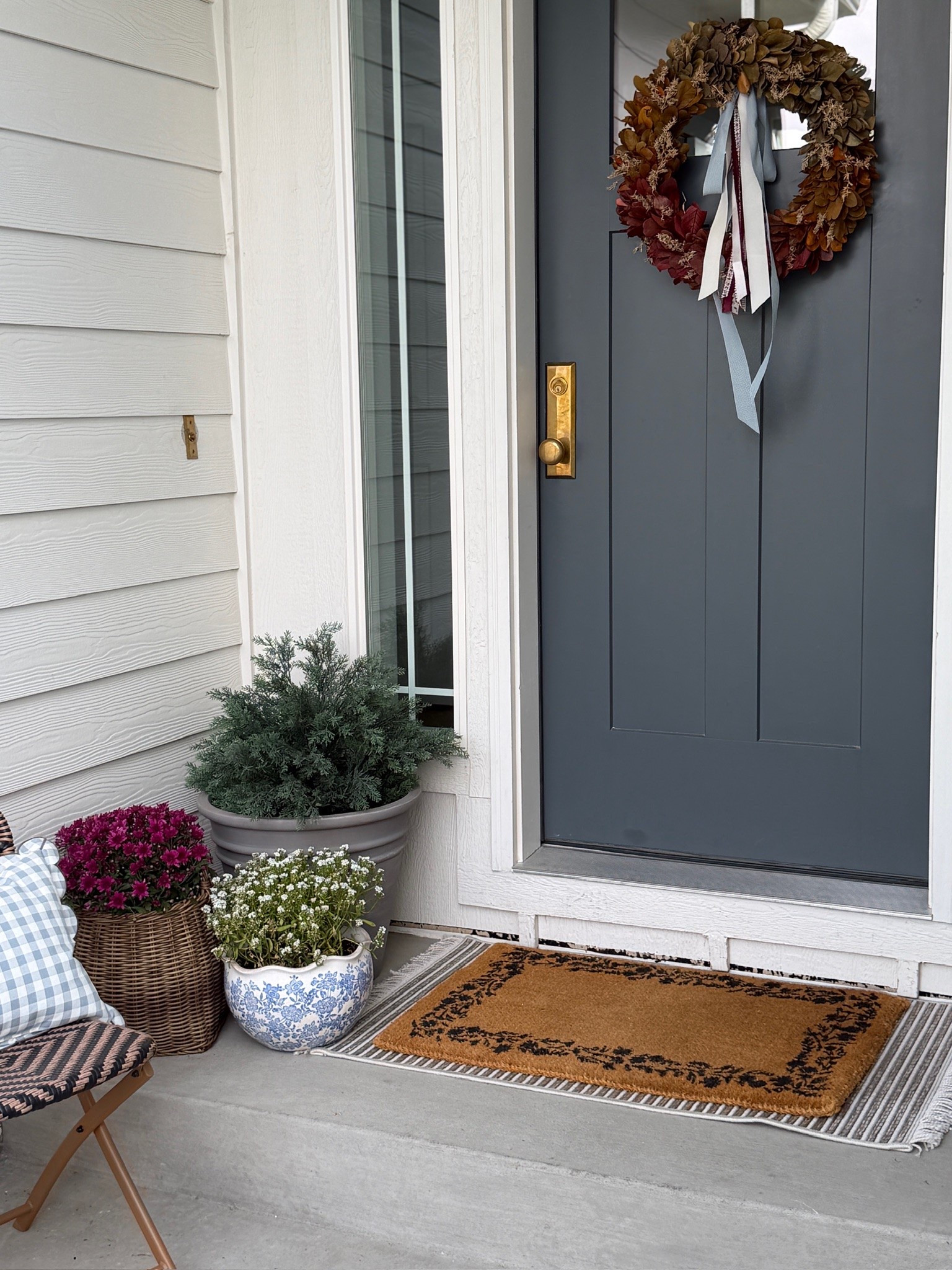 Our cozy front door is perfect for the end of summer transitioning into fall season 🍂 I love this fall wreath so much! 

Traditional style, front porch, fall decor

#LTKSeasonal #LTKHome