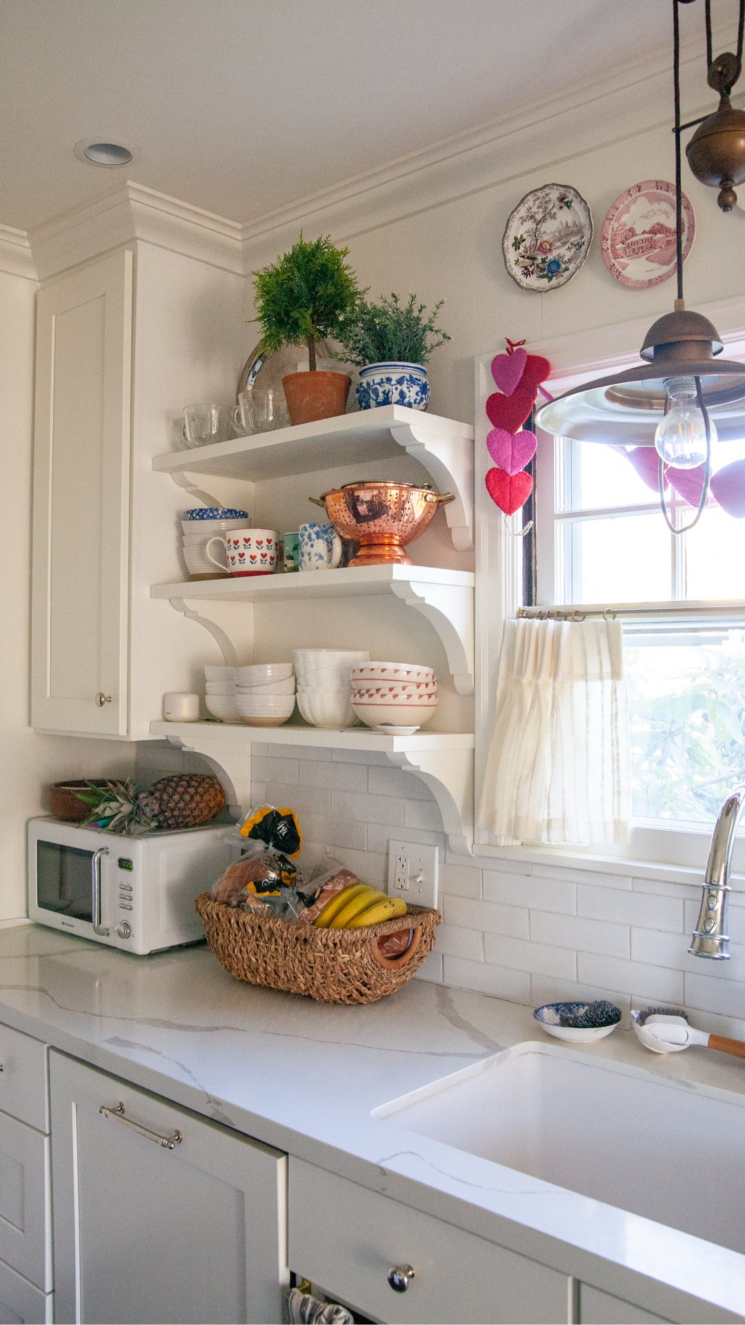 I heard this advice years ago and have thought about it plenty since… The idea is white is a great background for a beautiful, often colorful things. Like an art gallery, with large, plain walls that allow the art to shine.

I love my classic white kitchen, but I also love my peachy pink bedroom… What do you think?! 

Linking some Valentine’s Day decor faves in LTK. 

#LTKValentine #LTKHome #LTKSeasonal