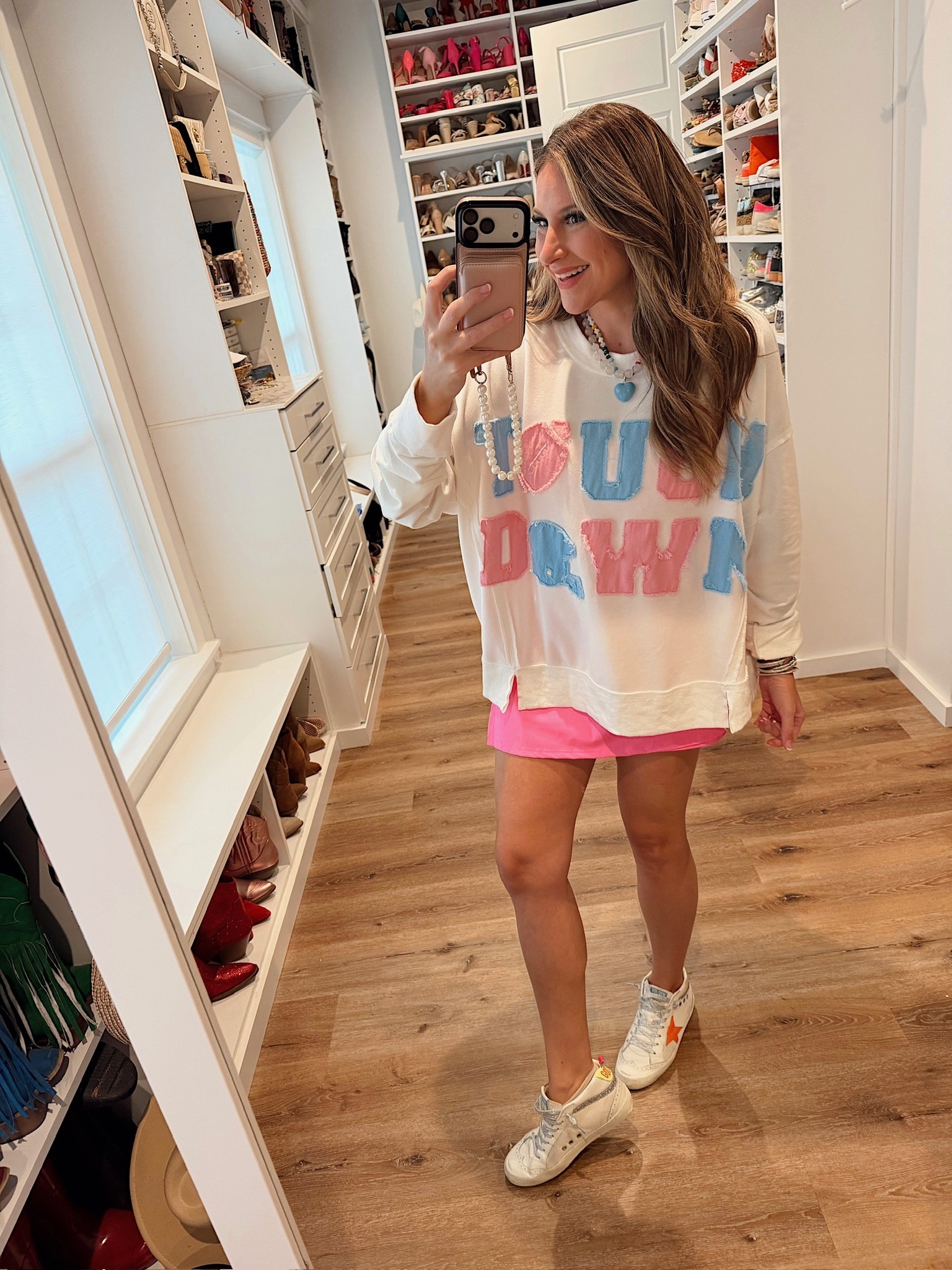 In a medium touch down varsity patch sweatshirt, medium tennis dress, necklace and accessories- fits tts.

#LTKStyleTip #LTKFindsUnder50 #LTKSeasonal