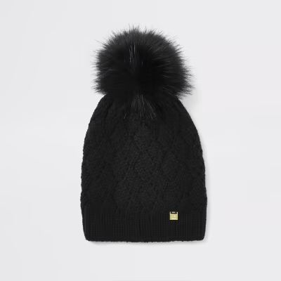 Black faux fur pom pom beanie hat | River Island (UK & IE)