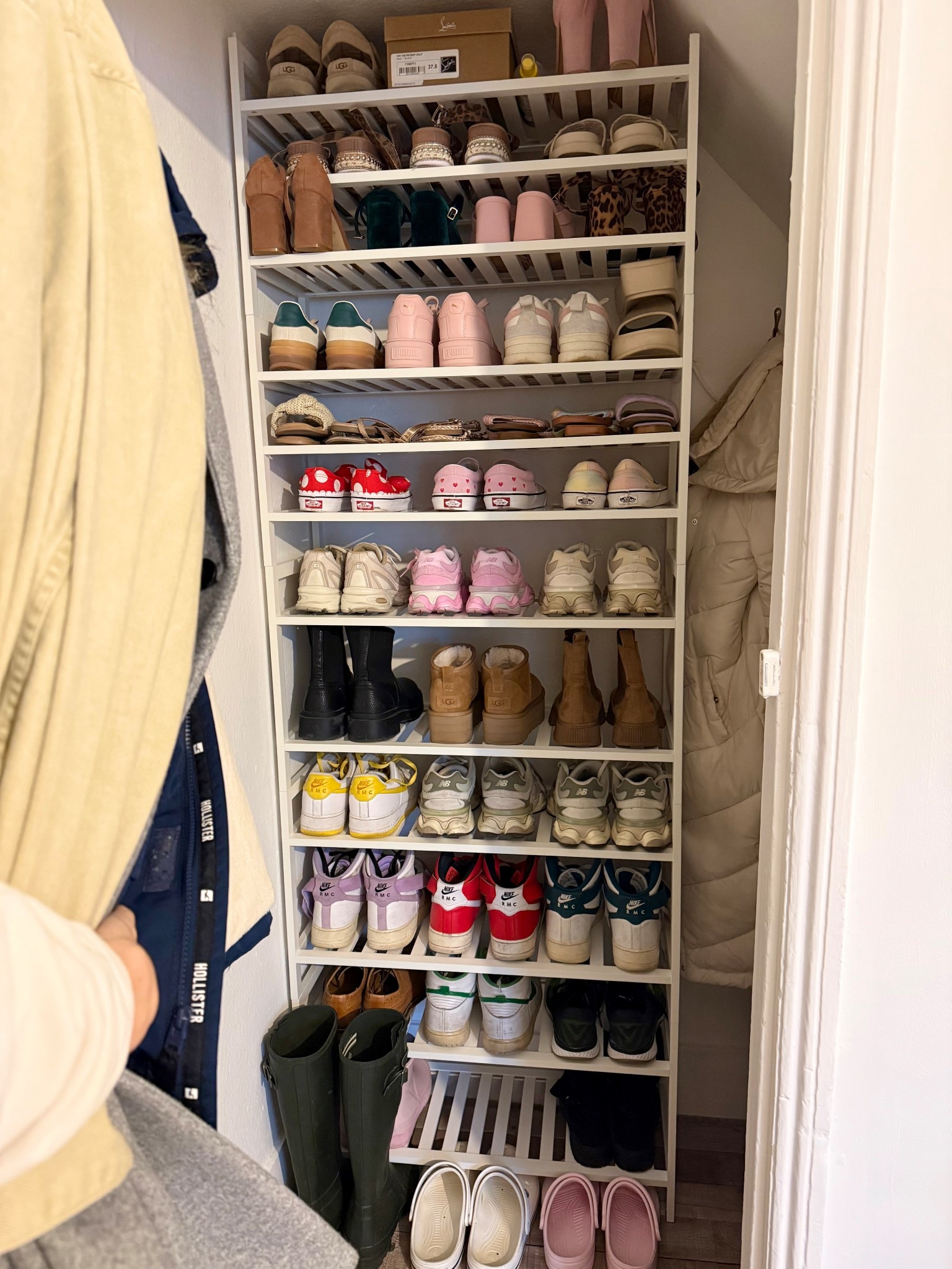 Stackable Shoe Racks! 
These shoe racks are a game changer as they are stackable so you can fit them to your cupboard size. 
We also bought 1 extra and drilled extra holes and added a shelf in for smaller shelves. 🤩
We have 5 racks here and 2 have an added shelf.