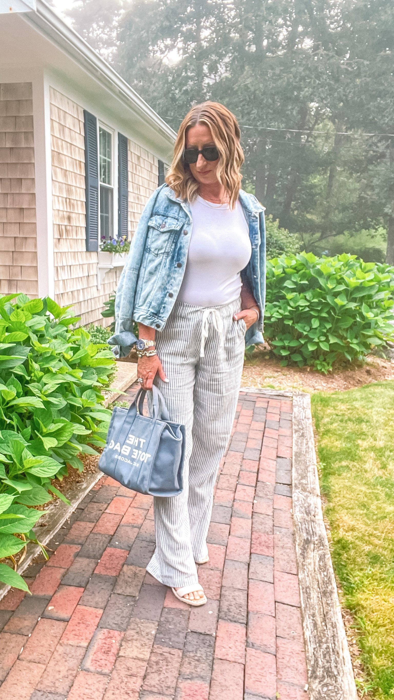 Summer outfit, linen pants, wide leg pants, white tank, wedge sandals, sandals, jean jacket, summer tote, sunglasses, summer look 

#LTKstyletip #LTKSeasonal #LTKsalealert