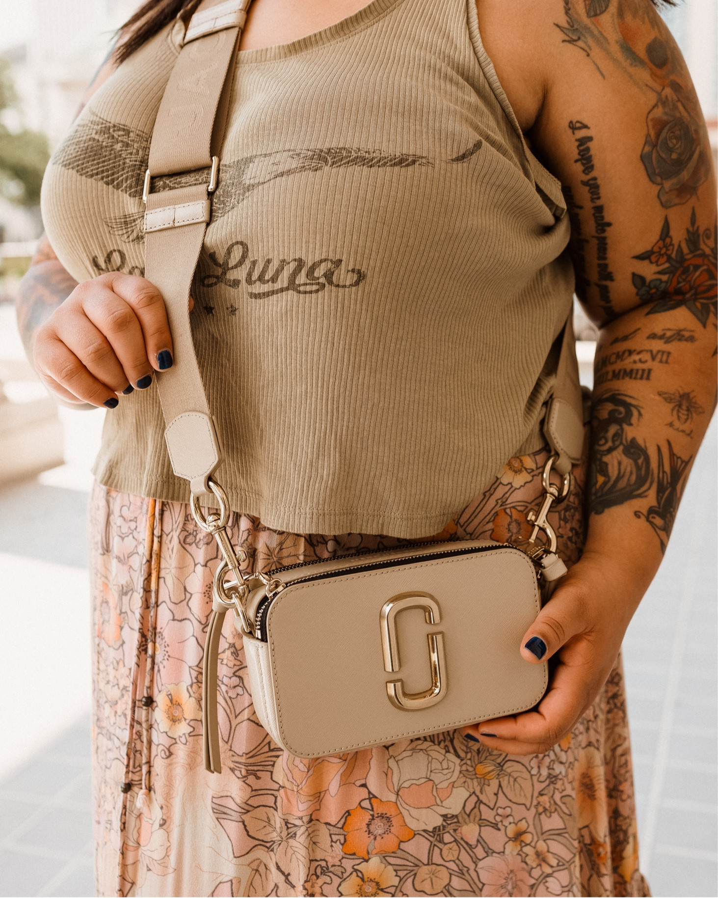 The Snapshot purse isn't just a pretty face. It is also incredibly functional with its compact size and multiple compartments. You can easily fit all of your must-have essentials like your phone, wallet, lotion, lipstick and keys in this purse without feeling weighed down. And if you're asthmatic, guess what? You're inhaler also fits with ease. With its adjustable strap, you can wear it as a shoulder or crossbody bag for added convenience.

#LTKsalealert #LTKworkwear #LTKxNSale