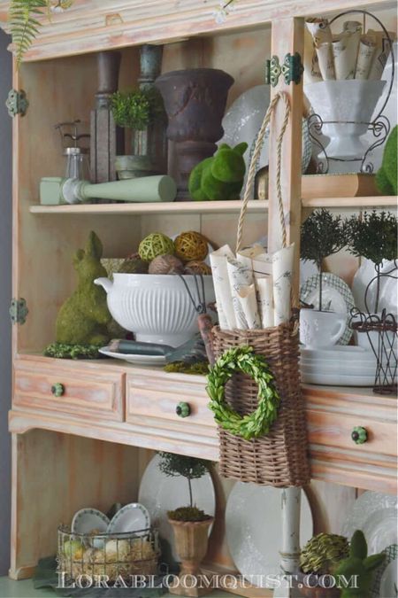 Greet Spring with garden-inspired style, mixing old and new. This Spring decorated hutch is bursting with beautiful textures. Moss bunnies and mini topiaries join vintage finds for classic garden style. 
See more at Lorabloomquist.com
Shop the look:

#LTKSeasonal #LTKhome #LTKFind