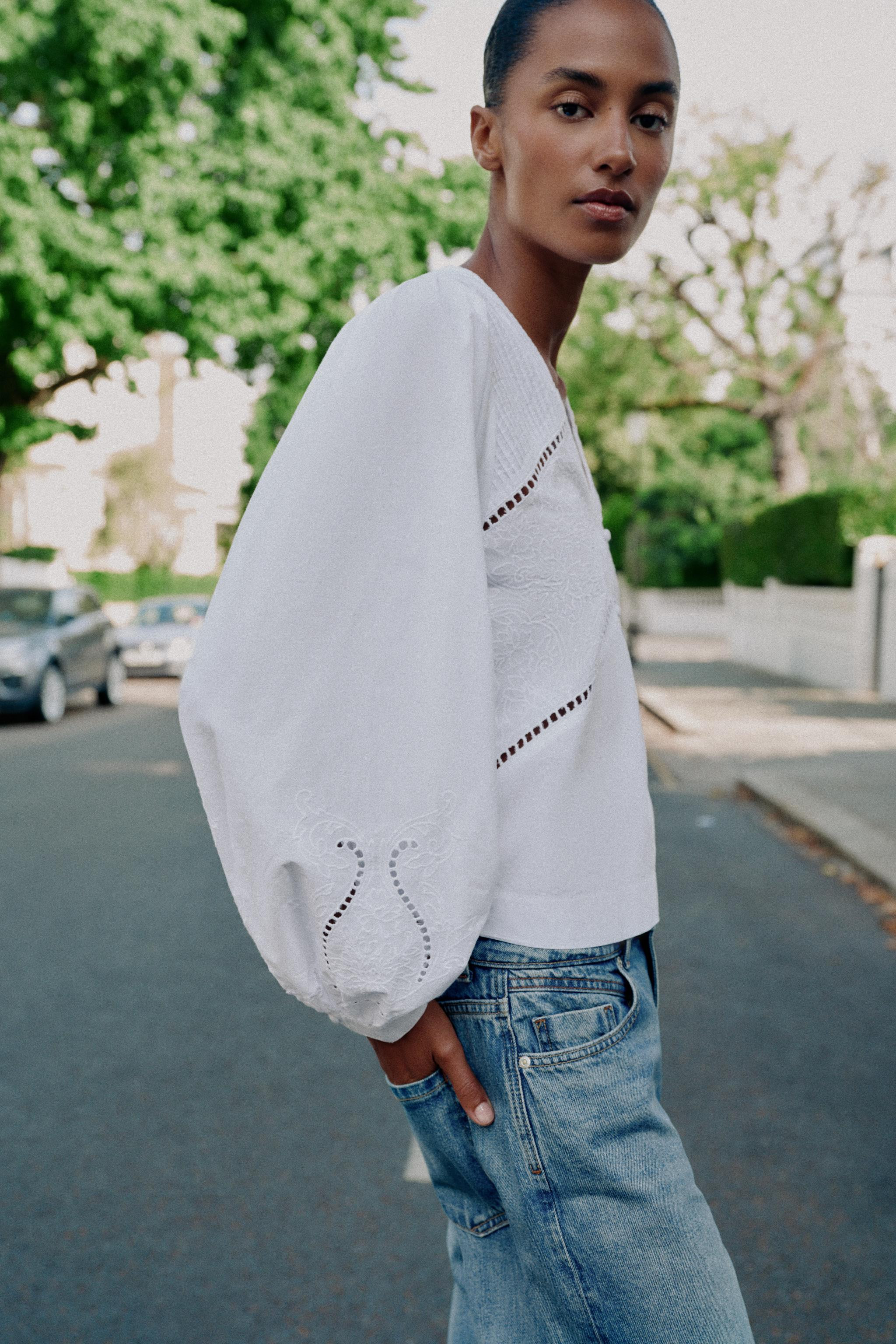 Model height: 183 cmV-neck shirt featuring pintucks and long sleeves with embroidery. Finished wi... | Zara UK