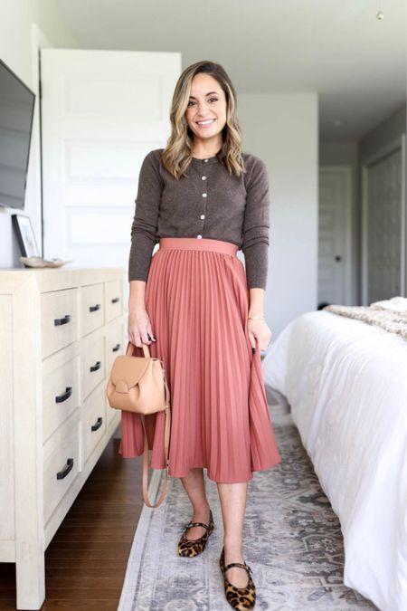 Capsule Series: four ways to wear a pleated skirt. With flats and a buttoned cardigan. 

Skirt: small color is “brown"
Sweater: xs 
Shoes: tts 
Bag: (can’t link) polene un nano in textured tan 

#LTKstyletip #LTKSeasonal