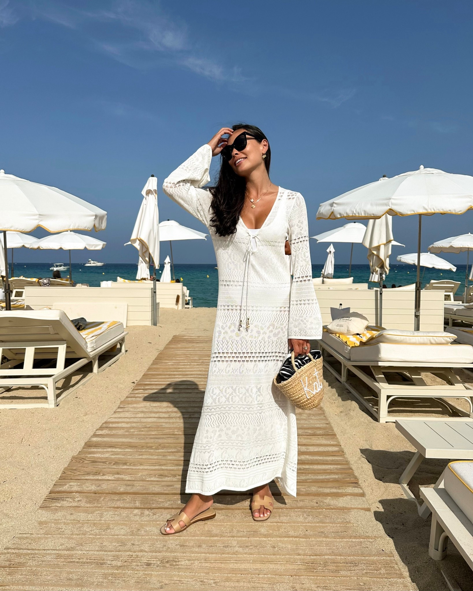 Kat Jamieson wears a white kaftan dress in St. Tropez. Swim coverup, summer fashion, vacation outfit, maxi dress, straw tote bag, Loulou beach club. 

Kaftan is from Camila (sold out, similar below!)

#LTKSwim #LTKTravel #LTKSeasonal
