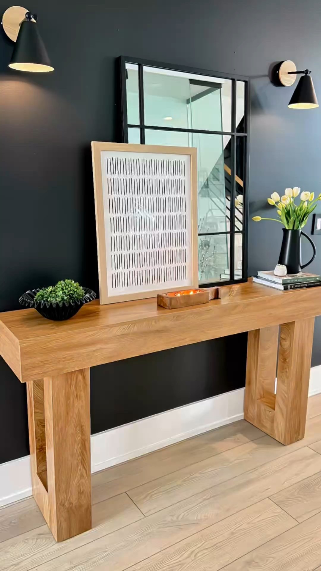 Timeless & Stylish: The Perfect Wood Console Table for Any Decor Style
Looking for a versatile console table that complements any decor style? This 63” wood console table from @shoptemu is the perfect blend of modern, rustic, and classic design, making it an effortless addition to any home.
To keep the styling simple yet elegant, I added a large mirror and framed art for depth, a black ruffle bowl with greenery for texture, and stacked books with a pitcher vase and fresh tulips to bring in warmth. A centered candle completes the look with a cozy touch.
This setup is easy to recreate and perfect for an entryway, living room, or dining space. Whether your home leans traditional, contemporary, or farmhouse, this chic and functional console table ties it all together beautifully.
Home Decor, Console Table Styling, Entryway Inspo, Timeless Design, Interior Styling 


#LTKHome #LTKWatchNow #LTKStyleTip