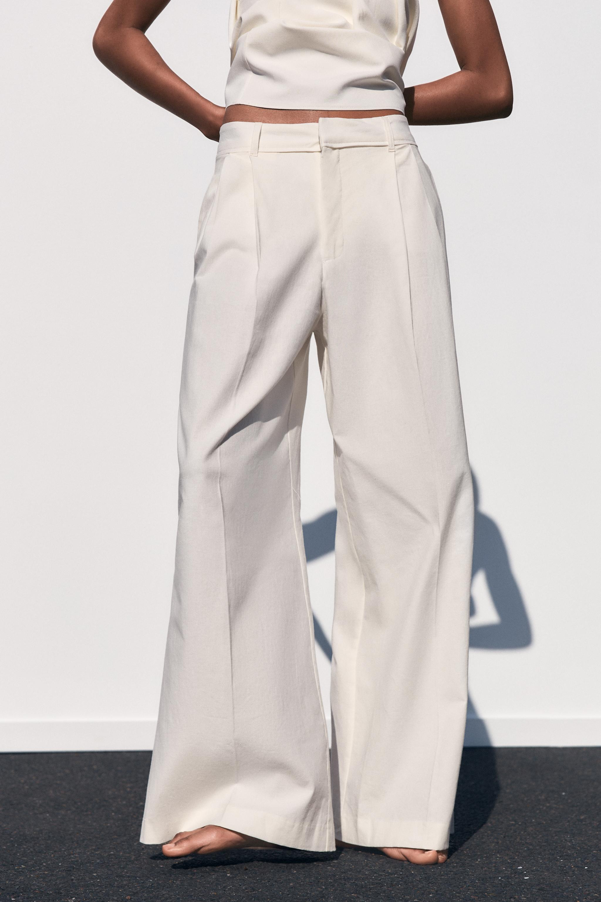 High-waisted pants with belt loops. Double pleat detail. Side pockets and back flap pockets. Fron... | Zara US