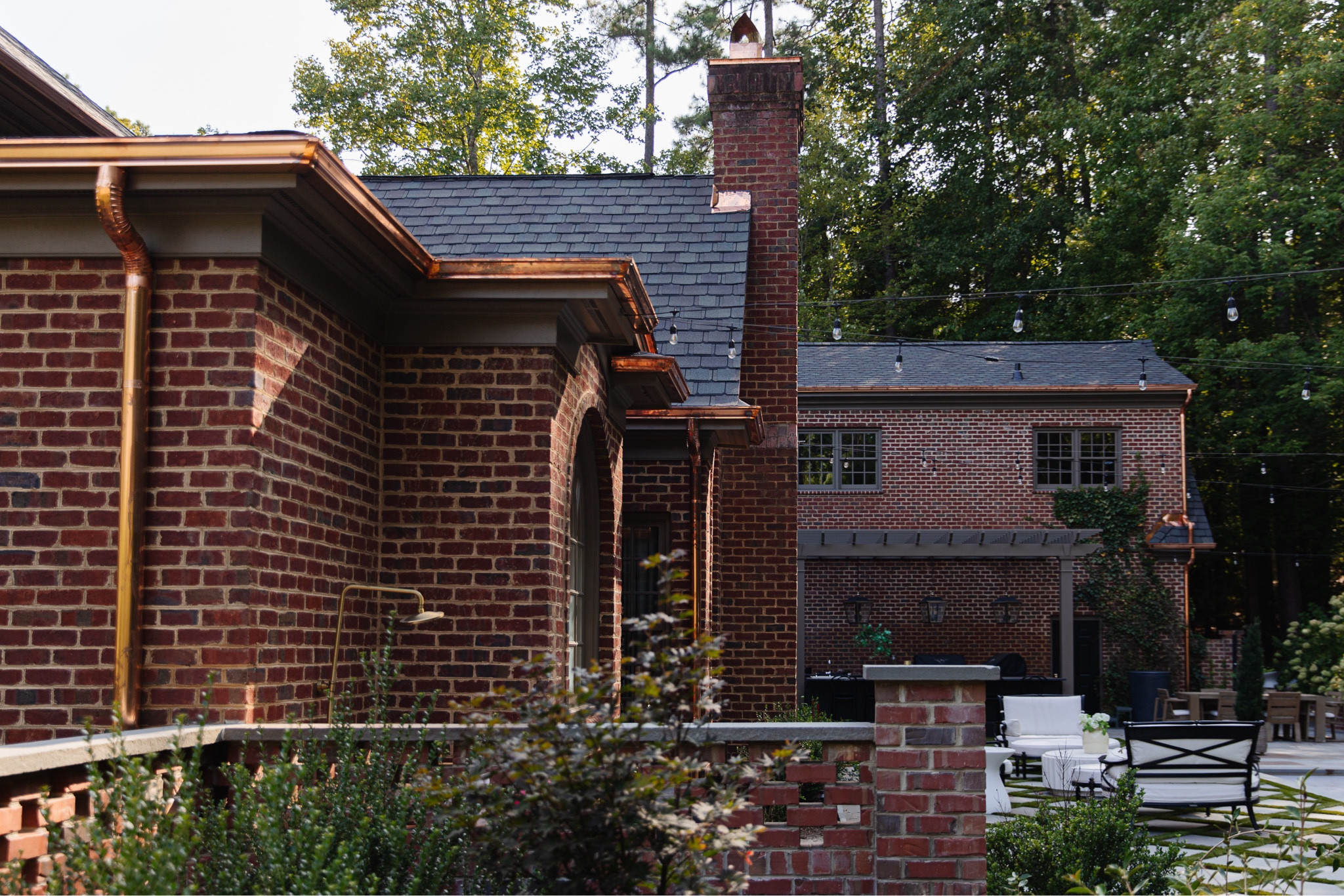 Spilling all of the details about our new copper gutters at ChrisLovesJulia.com today 🤎 I didn’t know this backyard could get any dreamier but here we are.

Outdoor furniture, pergola, outdoor lantern, string lights, outdoor showerr

#LTKHome #LTKStyleTip #LTKSeasonal