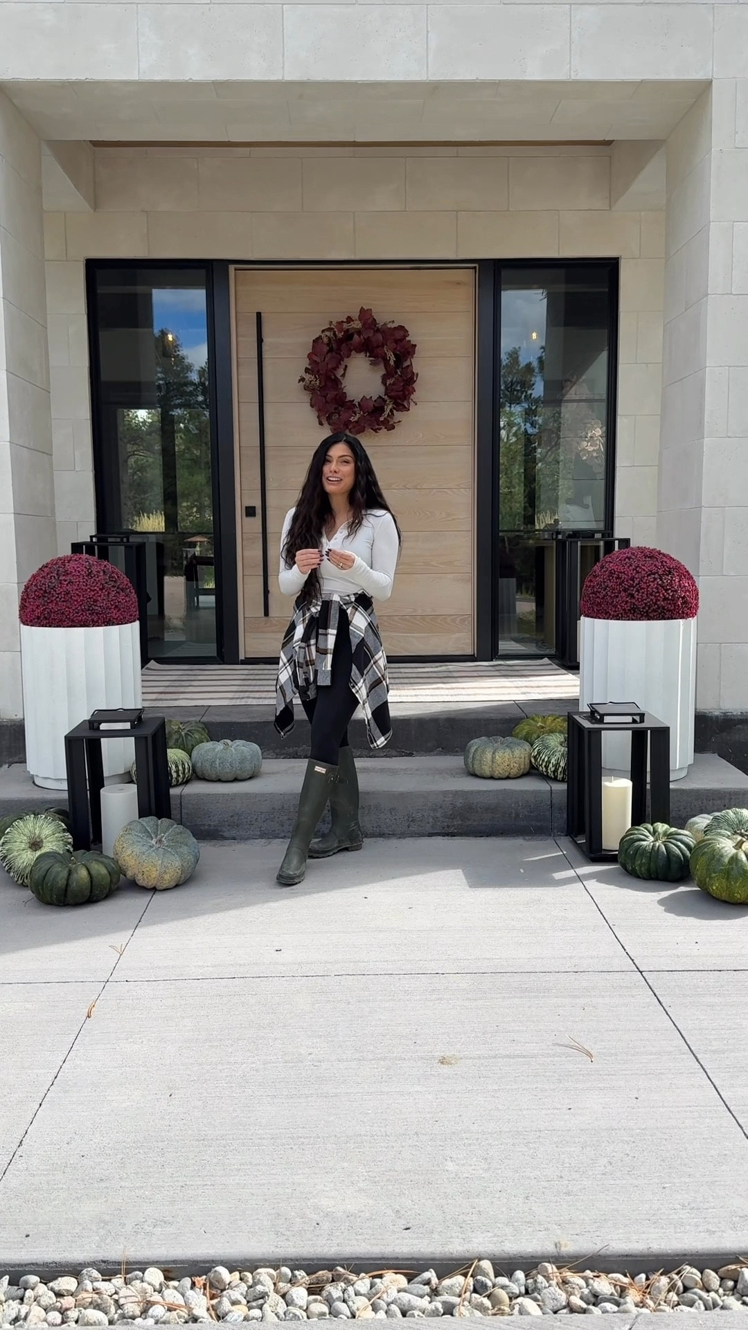 My simple fall porch. Faux mums, faux pumpkins, a few real pumpkin. Outdoor rug and wreath! These planters are sold out. I used the largest mum. You will want a planter with a diameter smaller than the mum. Hope this helps! The Malibu lantern is also sold out but I have the Caleb lantern on the way. Plaid is a few years old. 

#LTKSeasonal #LTKHome #LTKTall