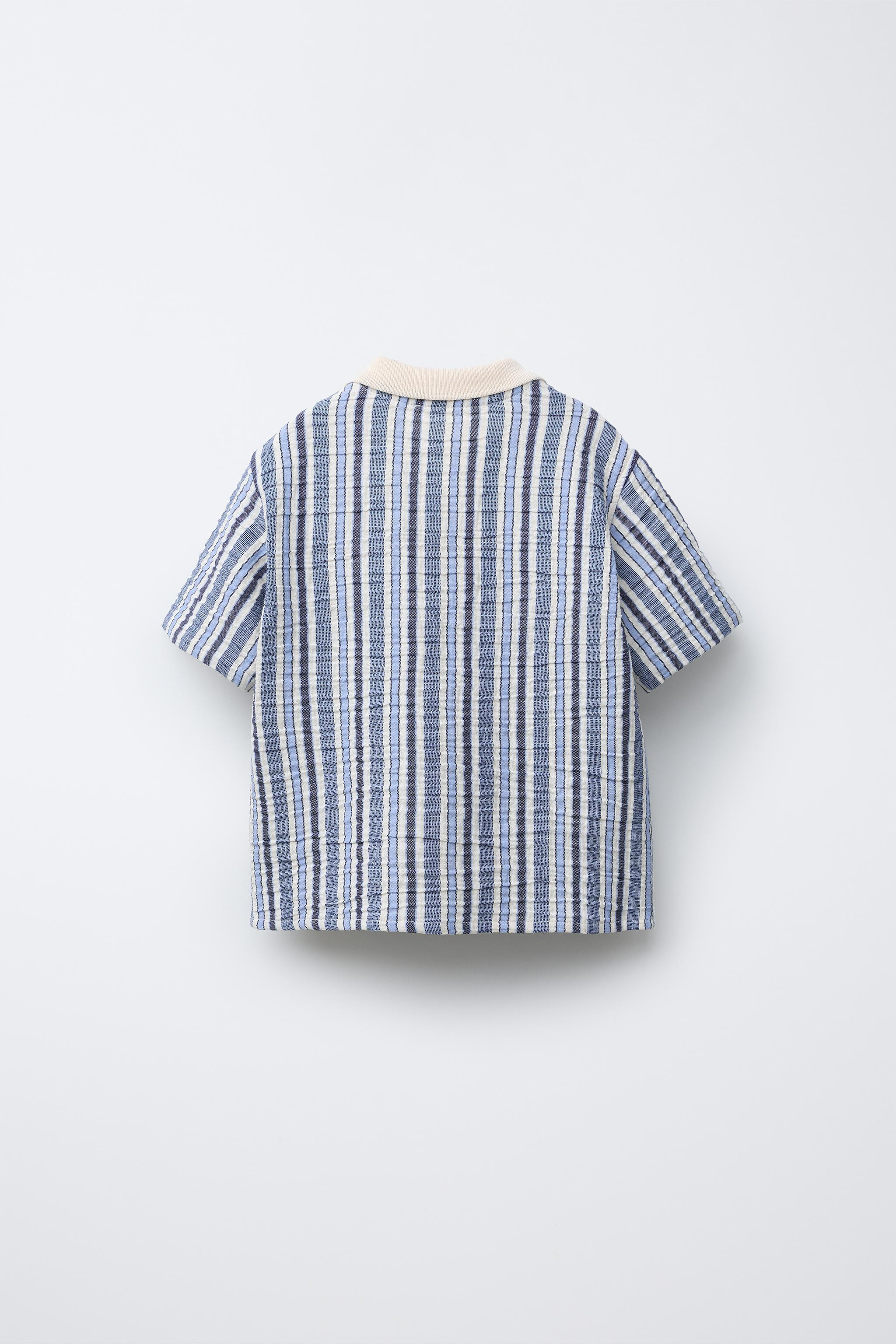 Short sleeve button-down shirt. Front button closure. Striped print. | Zara US