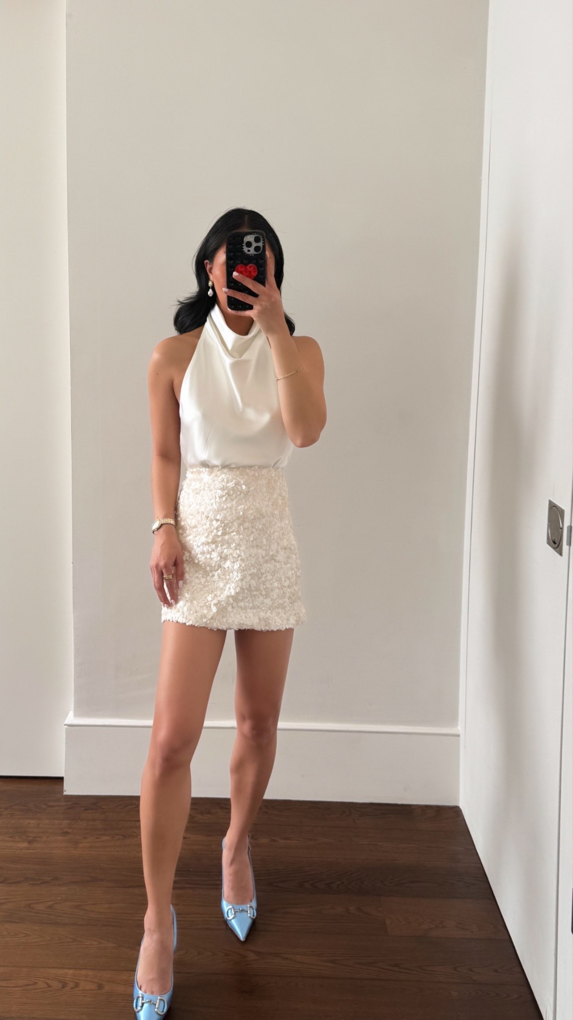 Dressier way to wear sequin skirt. I love this halter open back satin top. Would be stunning with denim / leather pants for a date night. But for a summer dinner outfit, I love the all white with a pop of color for the heels 

Top- M 
Skirt- S

#LTKSeasonal #LTKStyleTip #LTKFindsUnder100