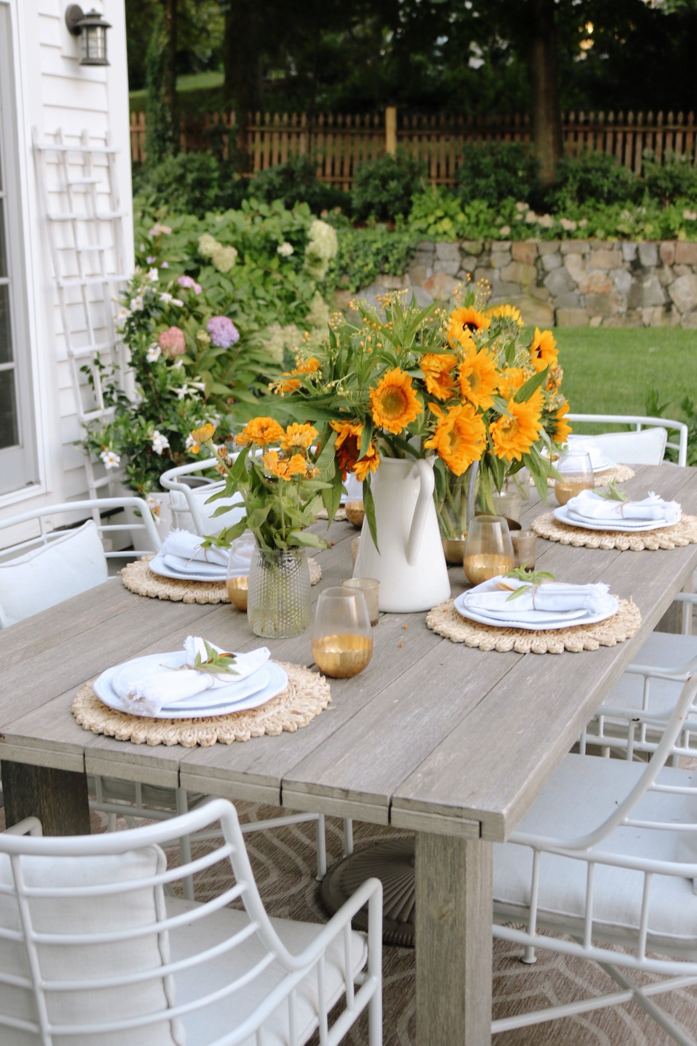 Outdoor setting with plates and modern outdoor seating. 

#LTKHome