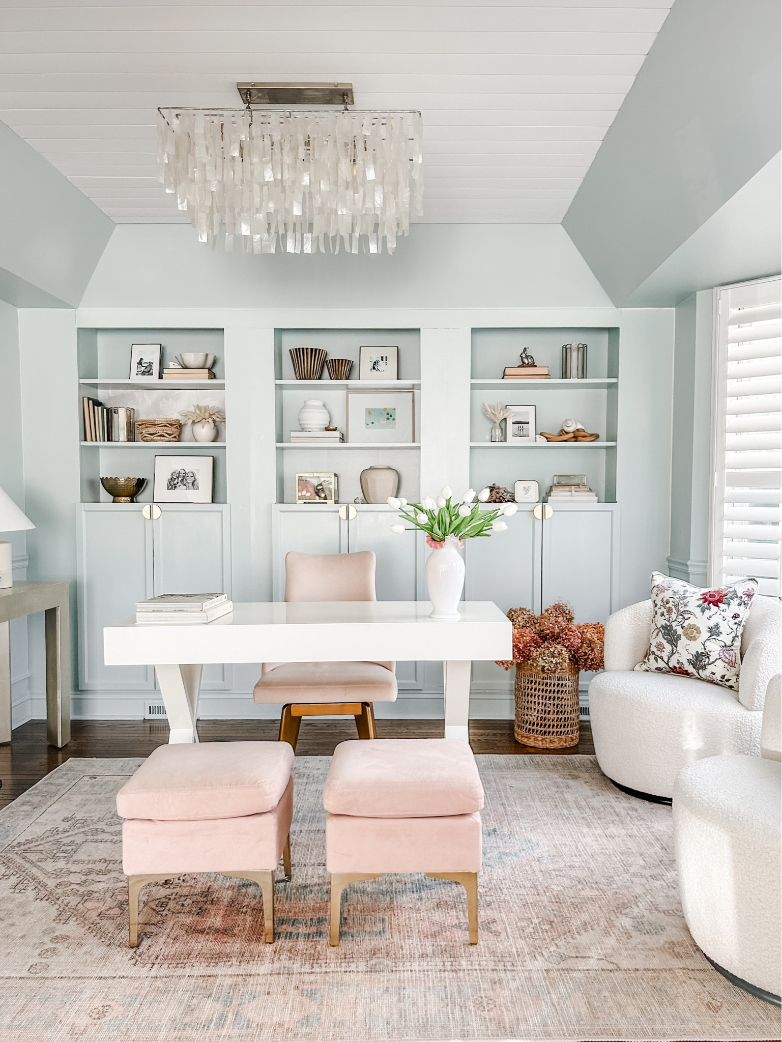 Castlery Swivel Chairs
Bouclè fabric swivel chairs
Capiz she’ll chandelier
White desk
Artificial tulips
Faux greenery
Faux tulips
Table lamp
Gold picture frame
Shelf decor
Home office decor
Coastal chandelier
White swivel chair
Wicker basket

#LTKStyleTip #LTKFindsUnder100 #LTKHome