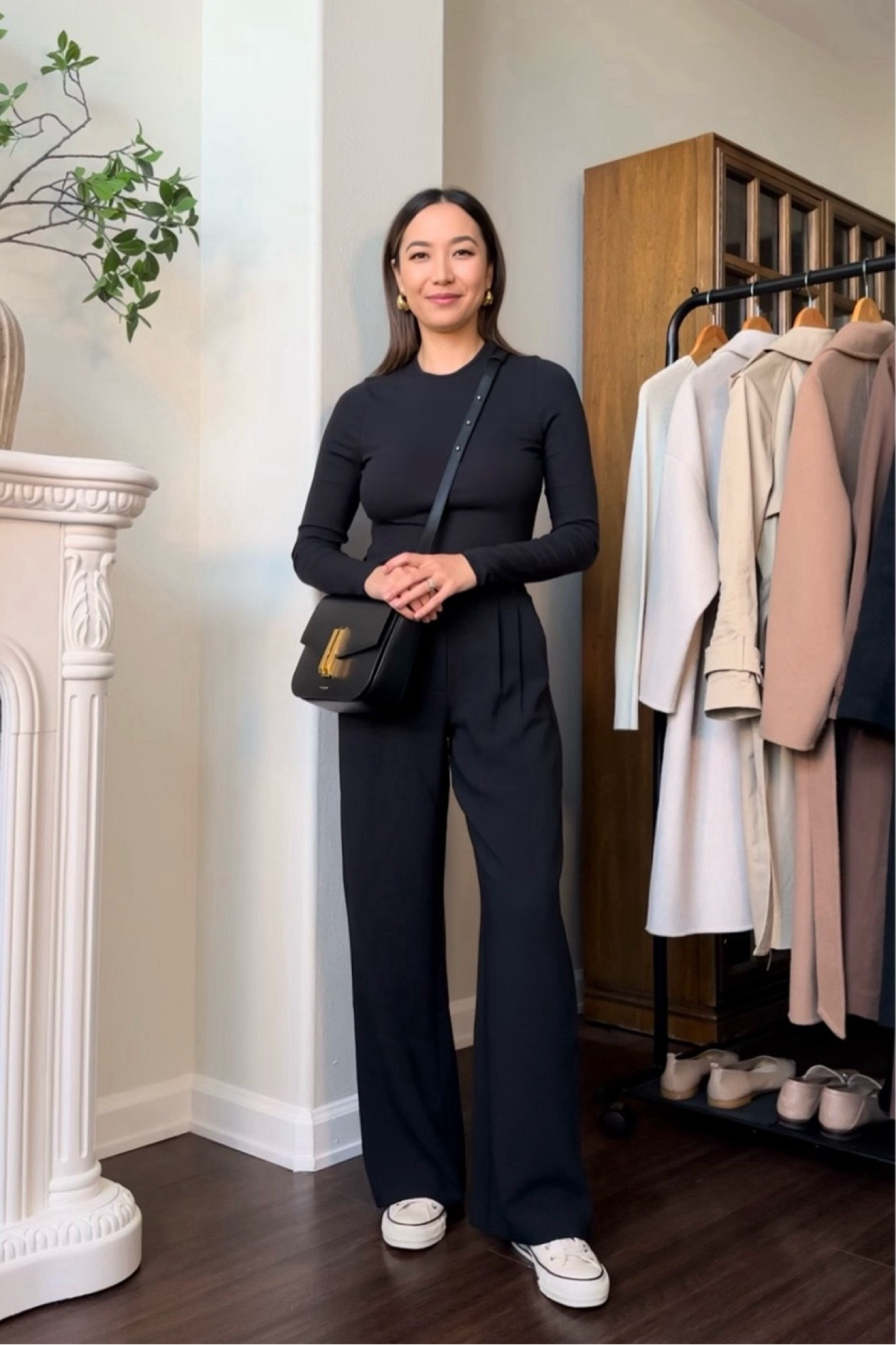 Travel capsule: 10x10 outfit 

Top - xs 
Pants - linked to newest + similar style, wearing 25 reg, if you’re under 5’4” I recommend getting the extra petite or petite length 
Elevated purse 
Converse 

Winter outfit / travel outfit / monochrome outfit 

#LTKStyleTip #LTKSeasonal