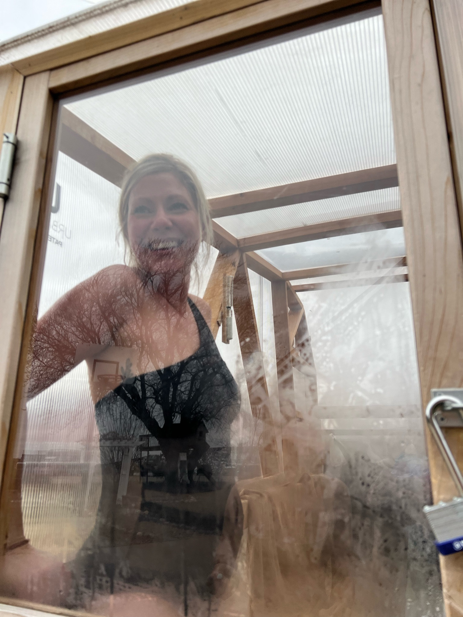 Black full-piece swimming suit. One strap, mesh middles  