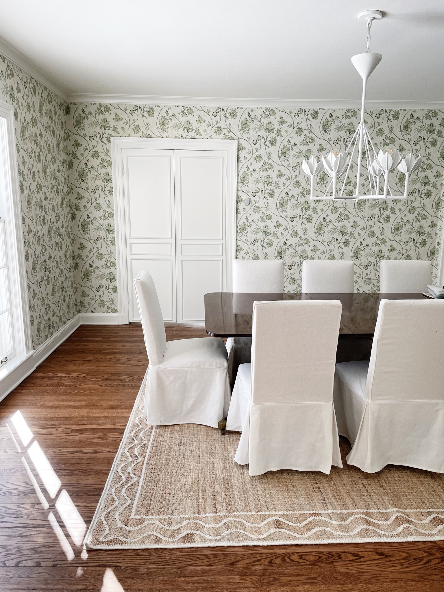 Our dining room almost makes me forget how cold it is outside. I love these slipcovered chairs. We bought 2 extra slipcovers for when someone spills wine or pasta. And this jute is the best - doesn’t shed and it’s flat, so it’s perfect for pulling chairs in and out. 

#LTKfamily #LTKstyletip #LTKhome