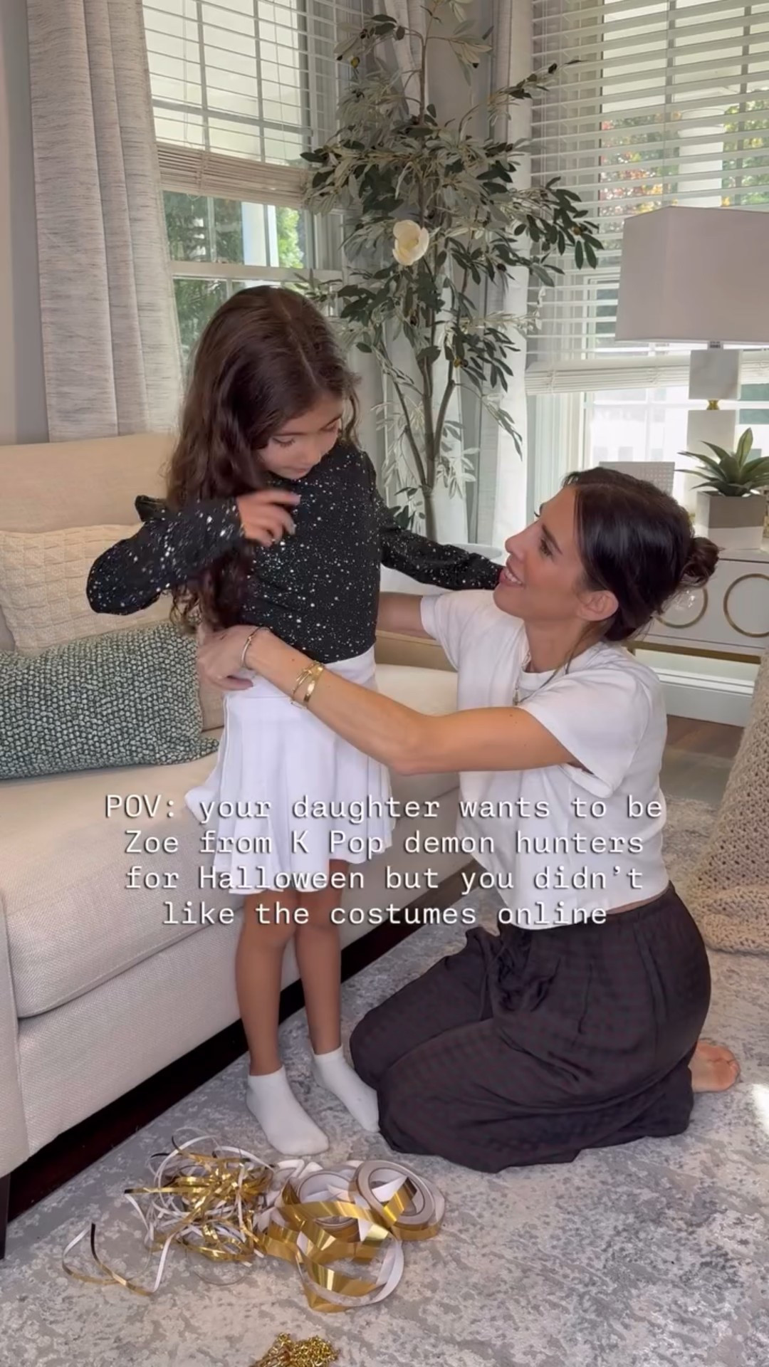 My daughter had to be Zoe from K-pop demon hunters for Halloween, along with every other girl her age, but I did not love any of the costumes I was seeing online, so we decided to get creative and make our own!

I just ordered a white tennis skirt, and sparkly black turtleneck on Amazon, along with a chain belt, some gold tape, and shoulder pads, and VOILA! I’m pretty impressed with the way it came out!

*After we finished, I used fabric glue to secure all the gold lines to the shirt! 

#demonhunters #costume #halloween #DIYcostume