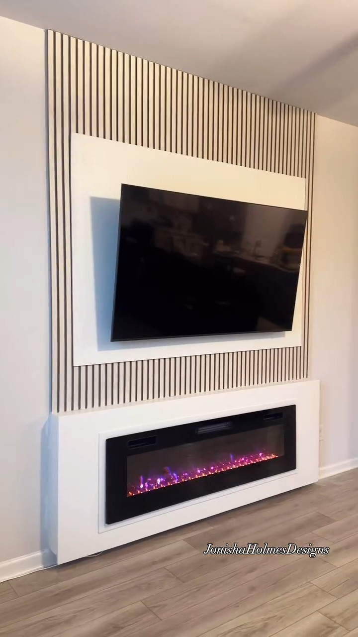 Before & After 🔥:

Before: A blank wall with a mounted TV and zero personality.

After: Total glow-up! ✨ We added a custom slat wall feature and an electric fireplace to turn this into the ultimate cozy vibe. What do y’all think? Did we nail it? 💯

Tag someone who needs a room makeover like this! 👇 #InteriorDesignGoals #ModernVibes #RoomGlowUp #FireplaceGoals