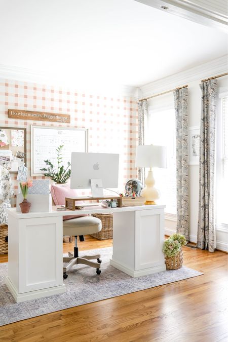 My office features a white paneled desk, plush chair, desktop computer, rug and a lot of organizational tools.

#LTKhome