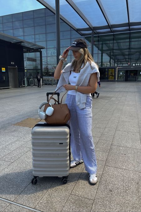 Airport outfit ✈️

Linen trousers, white vest, suit case, polene bag, Anine bing, travel outfit 

#LTKstyletip #LTKfindsunder50 #LTKtravel