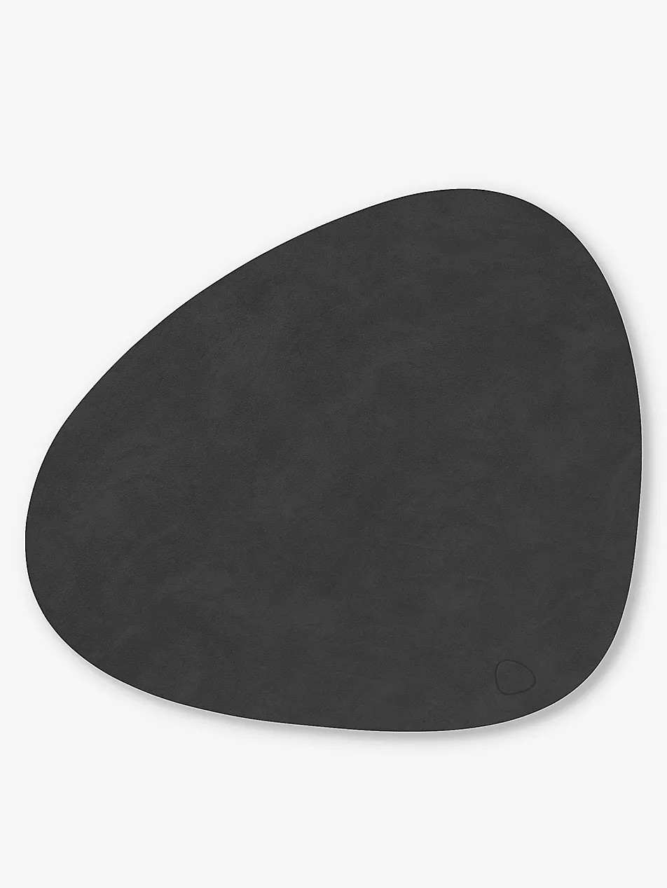 Curve leather table mat | Selfridges