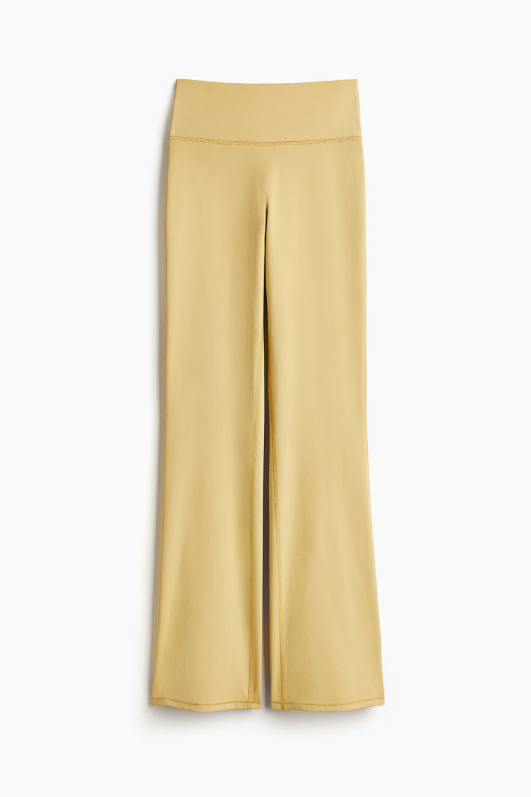 H & M - Flared sports leggings in SoftMove - Yellow | H&M (UK, MY, IN, SG, PH, TW, HK)