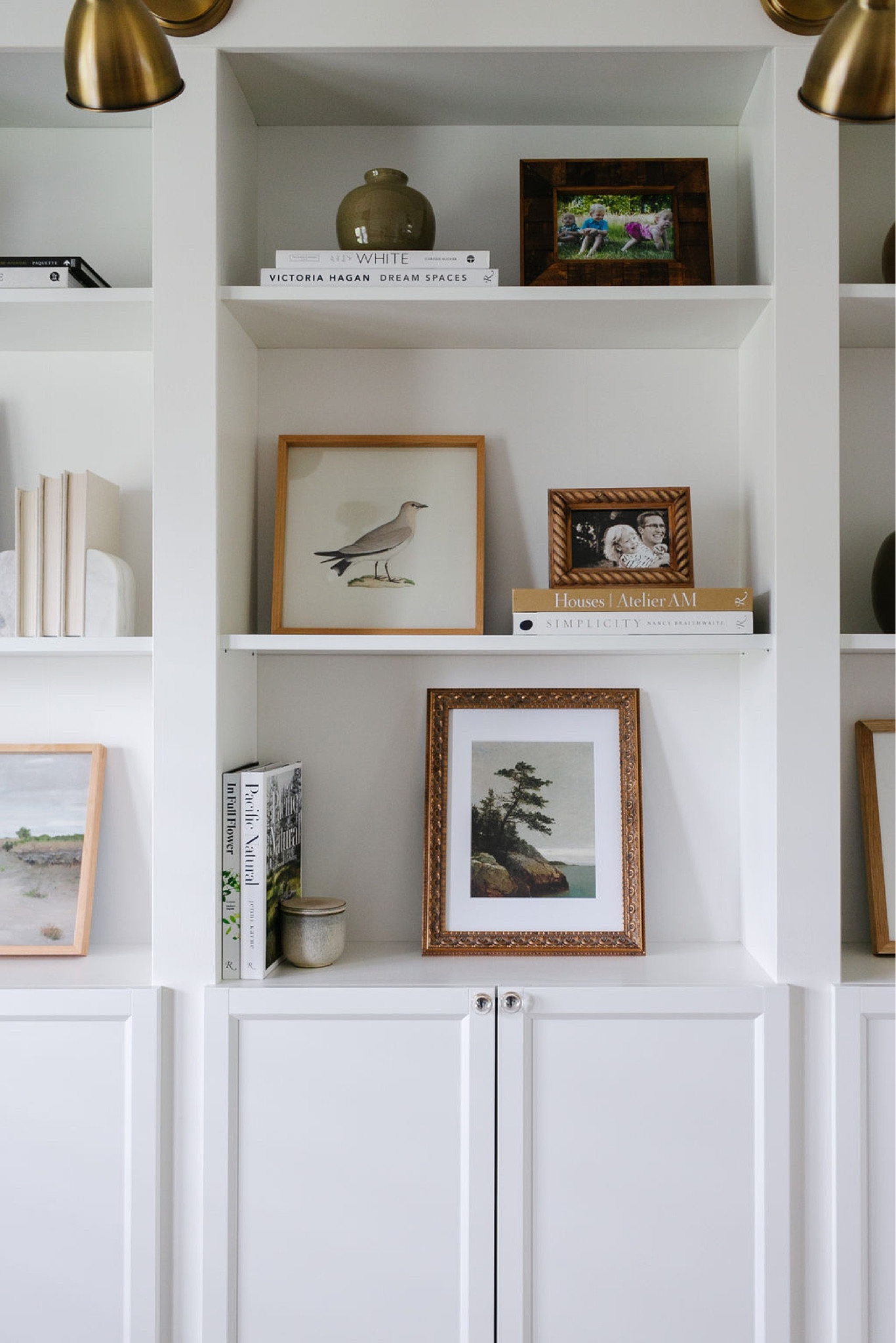 On my office bookshelves, I changed out a few pieces of artwork  

#LTKhome #LTKsalealert #LTKFind